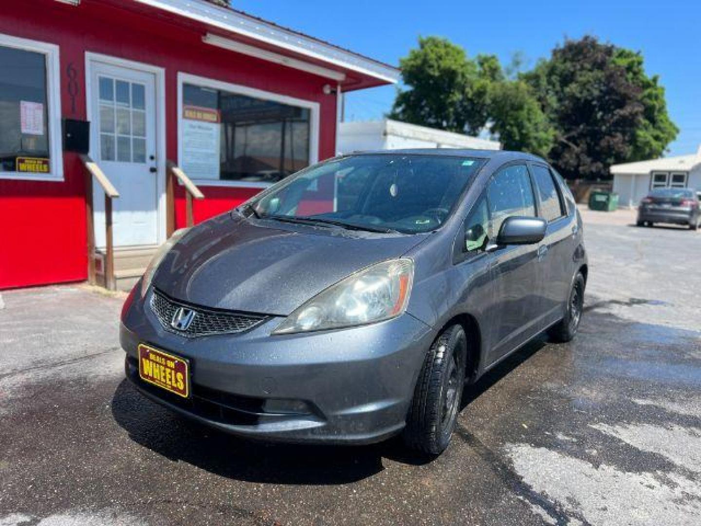 2012 Honda Fit 5-Speed MT (JHMGE8G34CC) with an 1.5L L4 SOHC 16V engine, 5-Speed Manual transmission, located at 601 E. Idaho St., Kalispell, MT, 59901, 48.203983, -114.308662 - Photo#0