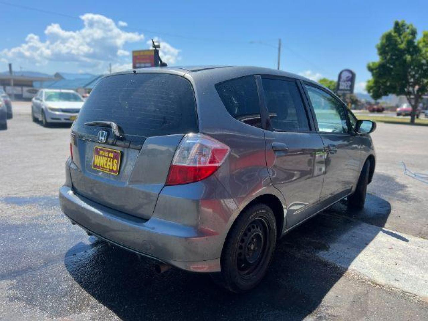 2012 Honda Fit 5-Speed MT (JHMGE8G34CC) with an 1.5L L4 SOHC 16V engine, 5-Speed Manual transmission, located at 601 E. Idaho St., Kalispell, MT, 59901, 48.203983, -114.308662 - Photo#5