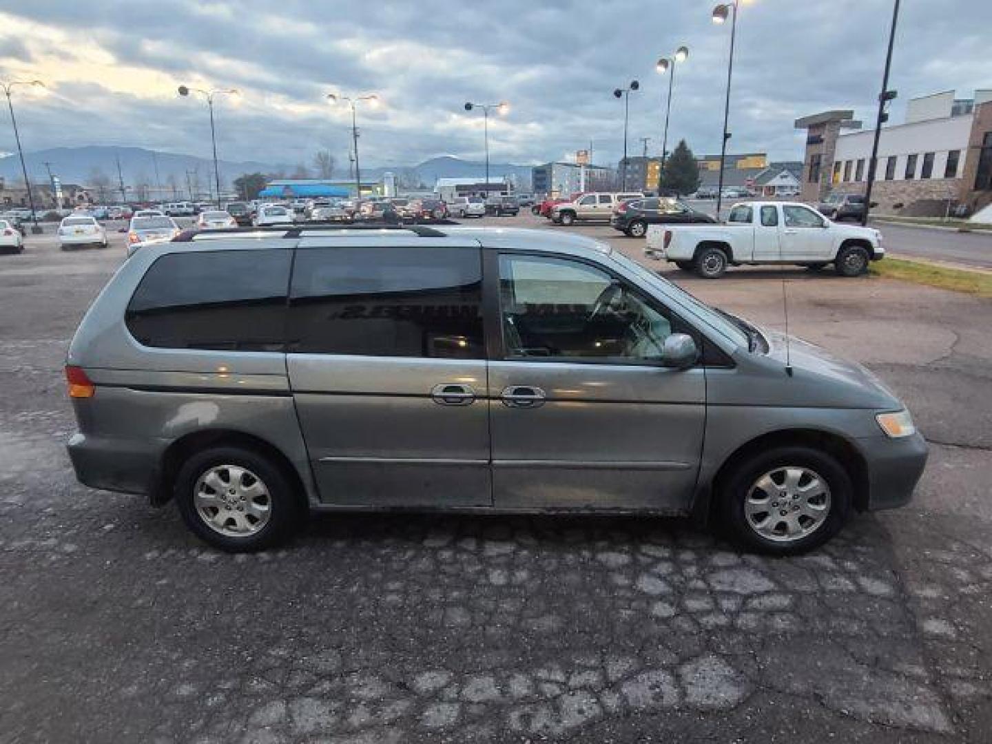 2002 Honda Odyssey EX (2HKRL18642H) with an 3.5L V6 SOHC 24V engine, 5-Speed Automatic transmission, located at 1800 West Broadway, Missoula, 59808, (406) 543-1986, 46.881348, -114.023628 - If you're in the market for a reliable and spacious pre-owned vehicle in Missoula, look no further than this 2002 Honda Odyssey EX available at DOW - Missoula. Priced at $12,995, this van is perfect for families, commuters, or anyone in need of a versatile and comfortable vehicle. The Honda Odyssey - Photo#2