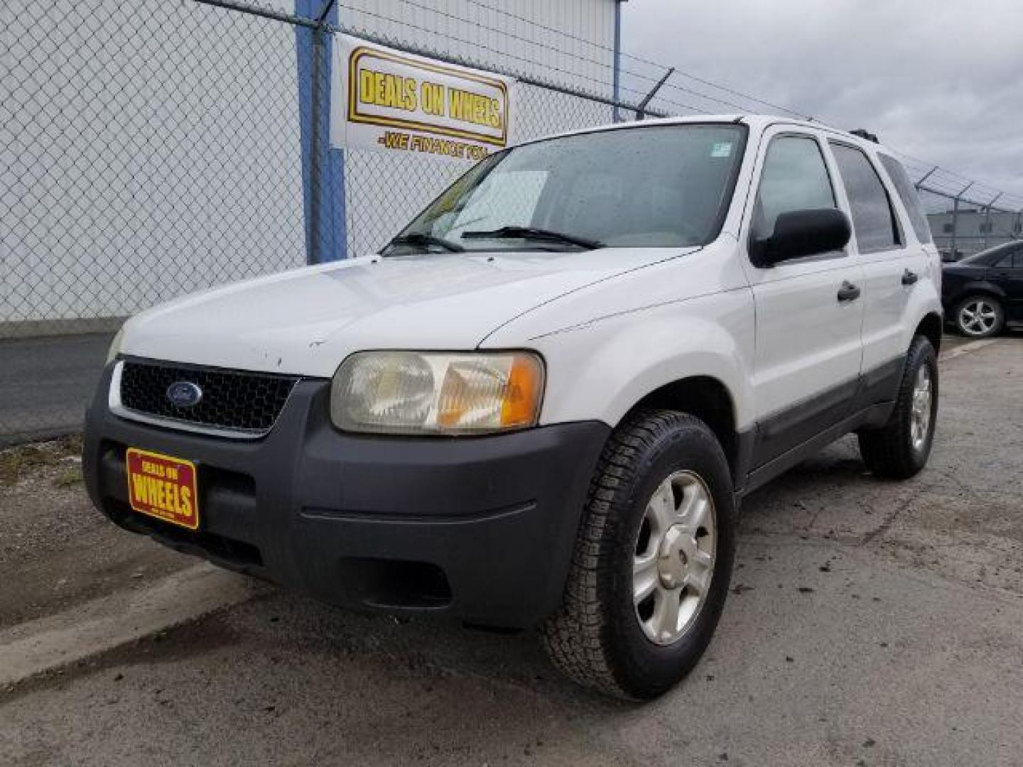 2004 Oxford White Ford Escape XLT 4WD (1FMYU93114D) with an 3.0L V6 DOHC 24V engine, 4-Speed Automatic transmission, located at 1821 N Montana Ave., Helena, MT, 59601, 46.603447, -112.022781 - Photo#0