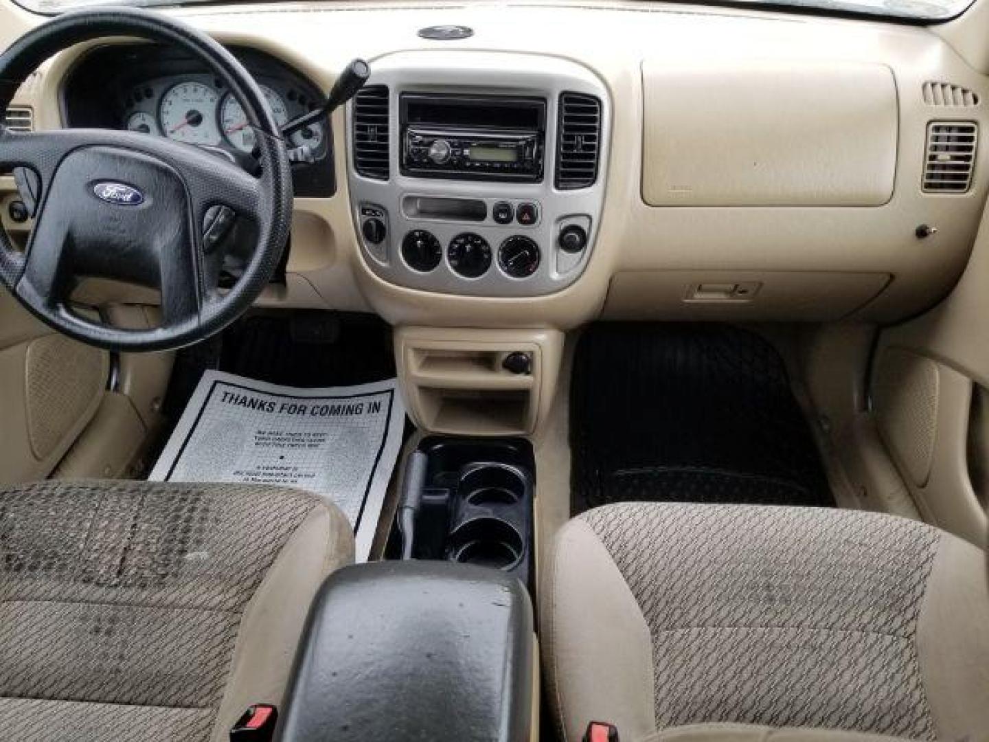 2004 Oxford White Ford Escape XLT 4WD (1FMYU93114D) with an 3.0L V6 DOHC 24V engine, 4-Speed Automatic transmission, located at 1821 N Montana Ave., Helena, MT, 59601, 46.603447, -112.022781 - Photo#11