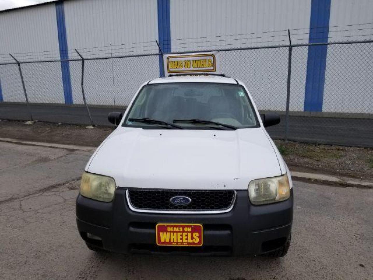 2004 Oxford White Ford Escape XLT 4WD (1FMYU93114D) with an 3.0L V6 DOHC 24V engine, 4-Speed Automatic transmission, located at 1821 N Montana Ave., Helena, MT, 59601, 46.603447, -112.022781 - Photo#1