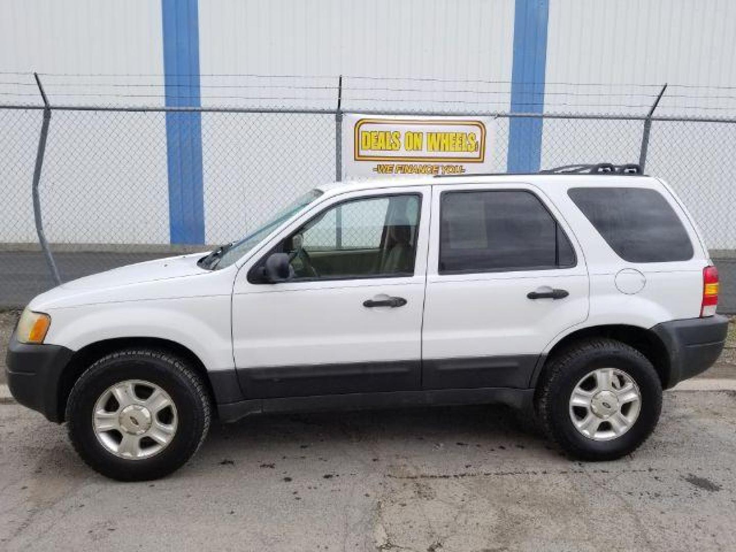 2004 Oxford White Ford Escape XLT 4WD (1FMYU93114D) with an 3.0L V6 DOHC 24V engine, 4-Speed Automatic transmission, located at 1821 N Montana Ave., Helena, MT, 59601, 46.603447, -112.022781 - Photo#2