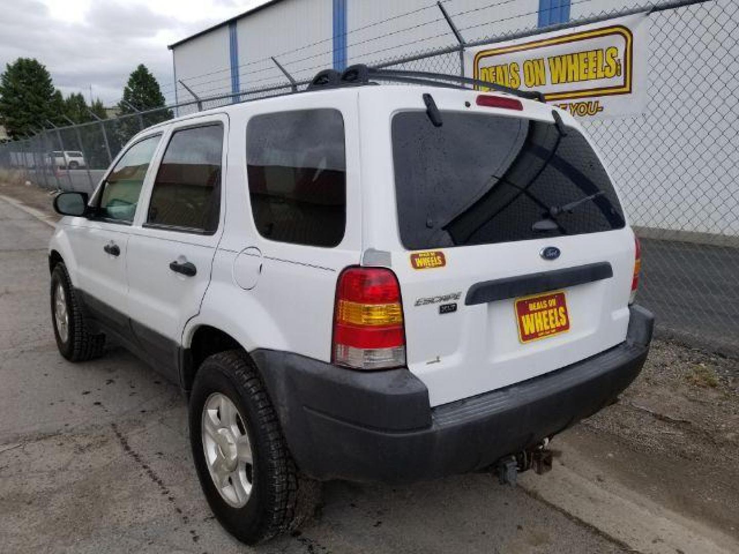 2004 Oxford White Ford Escape XLT 4WD (1FMYU93114D) with an 3.0L V6 DOHC 24V engine, 4-Speed Automatic transmission, located at 1821 N Montana Ave., Helena, MT, 59601, 46.603447, -112.022781 - Photo#3