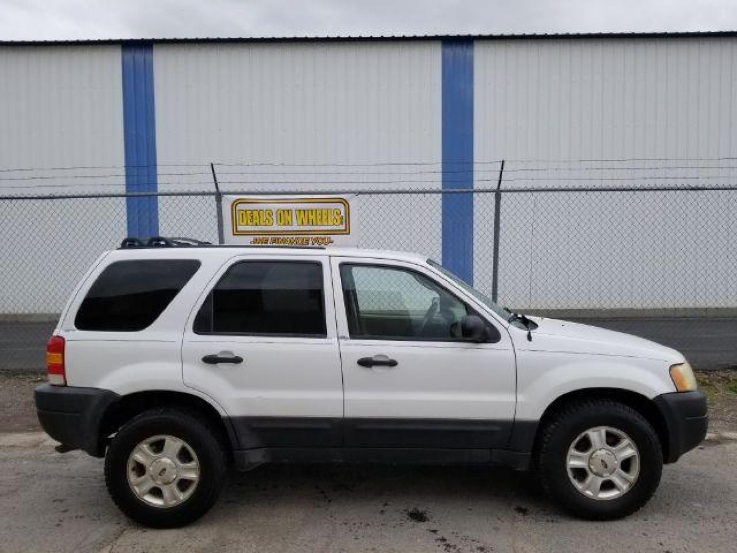 2004 Oxford White Ford Escape XLT 4WD (1FMYU93114D) with an 3.0L V6 DOHC 24V engine, 4-Speed Automatic transmission, located at 1821 N Montana Ave., Helena, MT, 59601, 46.603447, -112.022781 - Photo#5