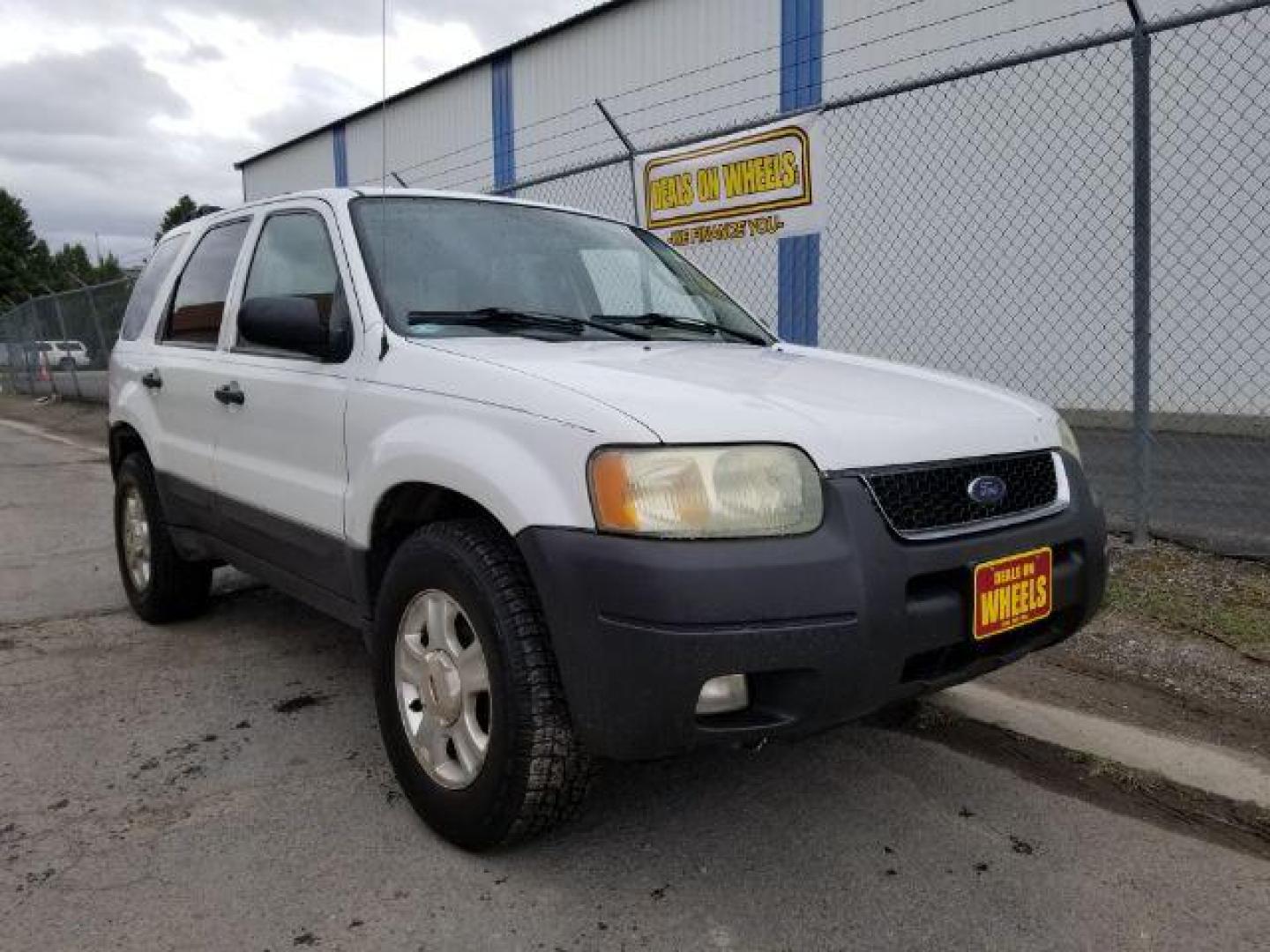 2004 Oxford White Ford Escape XLT 4WD (1FMYU93114D) with an 3.0L V6 DOHC 24V engine, 4-Speed Automatic transmission, located at 1821 N Montana Ave., Helena, MT, 59601, 46.603447, -112.022781 - Photo#6