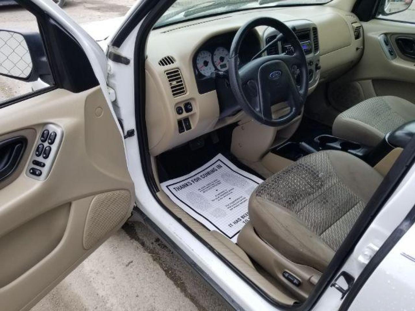 2004 Oxford White Ford Escape XLT 4WD (1FMYU93114D) with an 3.0L V6 DOHC 24V engine, 4-Speed Automatic transmission, located at 1821 N Montana Ave., Helena, MT, 59601, 46.603447, -112.022781 - Photo#7