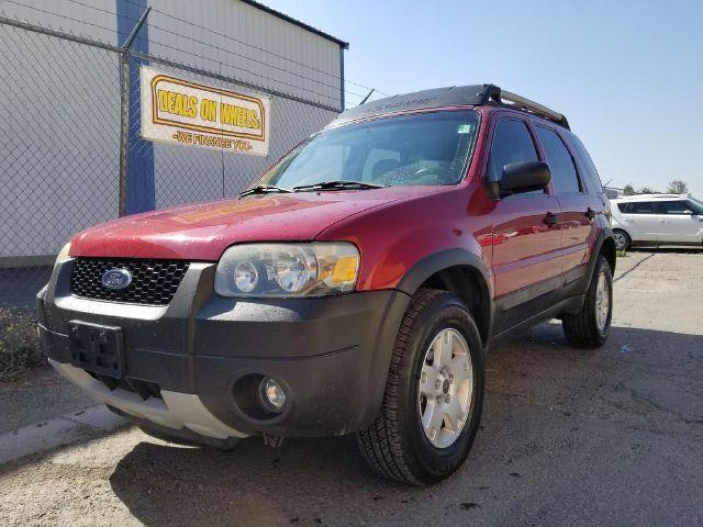 2005 Red Fire Metallic Ford Escape XLT 4WD (1FMYU93125K) with an 3.0L V6 DOHC 24V engine, 4-Speed Automatic transmission, located at 4801 10th Ave S,, Great Falls, MT, 59405, 47.494347, -111.229942 - Photo#0