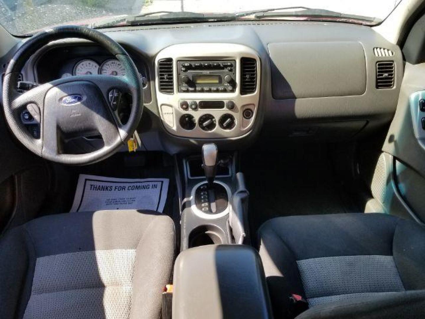 2005 Red Fire Metallic Ford Escape XLT 4WD (1FMYU93125K) with an 3.0L V6 DOHC 24V engine, 4-Speed Automatic transmission, located at 4801 10th Ave S,, Great Falls, MT, 59405, 47.494347, -111.229942 - Photo#11