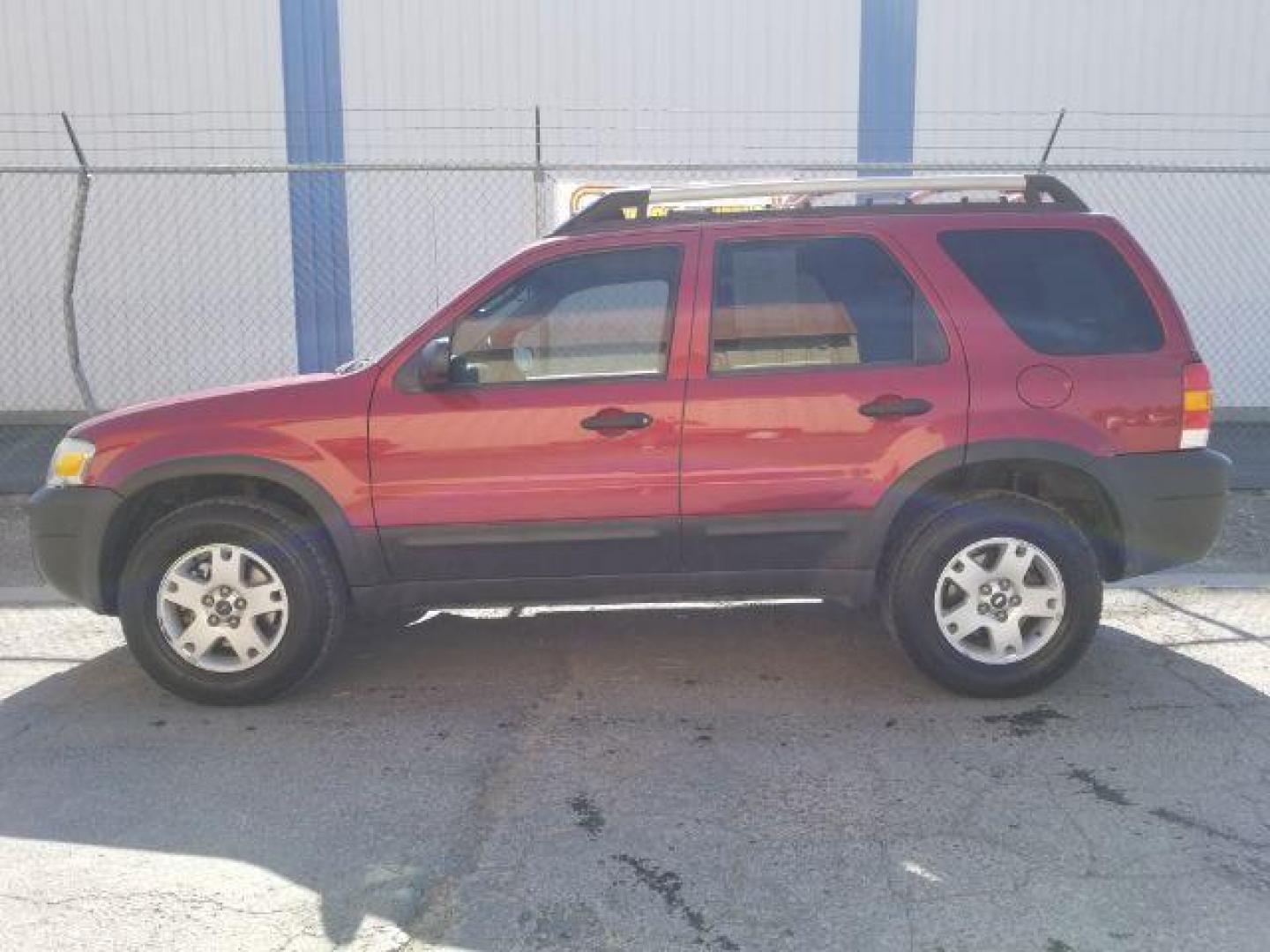 2005 Red Fire Metallic Ford Escape XLT 4WD (1FMYU93125K) with an 3.0L V6 DOHC 24V engine, 4-Speed Automatic transmission, located at 4801 10th Ave S,, Great Falls, MT, 59405, 47.494347, -111.229942 - Photo#2