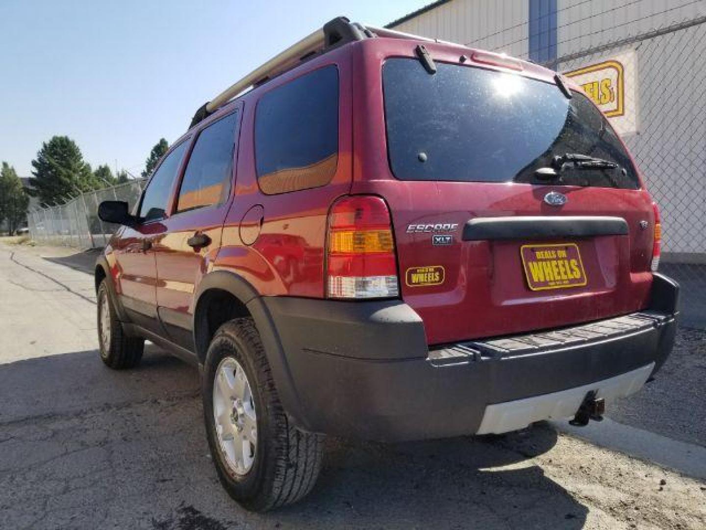 2005 Red Fire Metallic Ford Escape XLT 4WD (1FMYU93125K) with an 3.0L V6 DOHC 24V engine, 4-Speed Automatic transmission, located at 4801 10th Ave S,, Great Falls, MT, 59405, 47.494347, -111.229942 - Photo#3