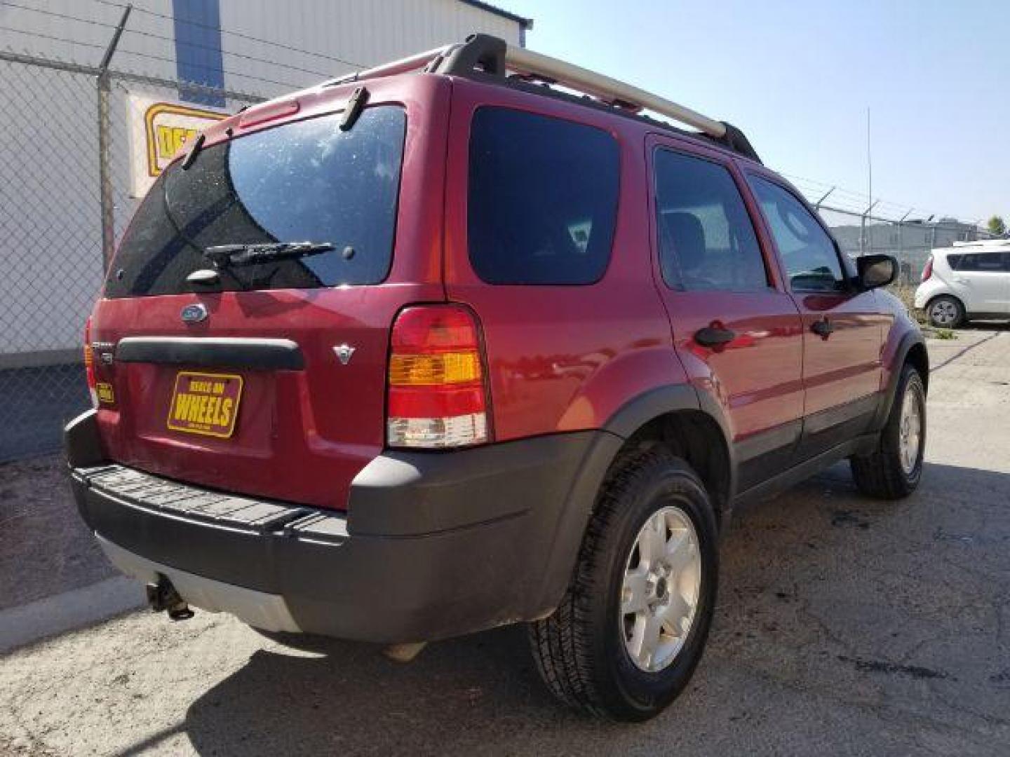 2005 Red Fire Metallic Ford Escape XLT 4WD (1FMYU93125K) with an 3.0L V6 DOHC 24V engine, 4-Speed Automatic transmission, located at 4801 10th Ave S,, Great Falls, MT, 59405, 47.494347, -111.229942 - Photo#4