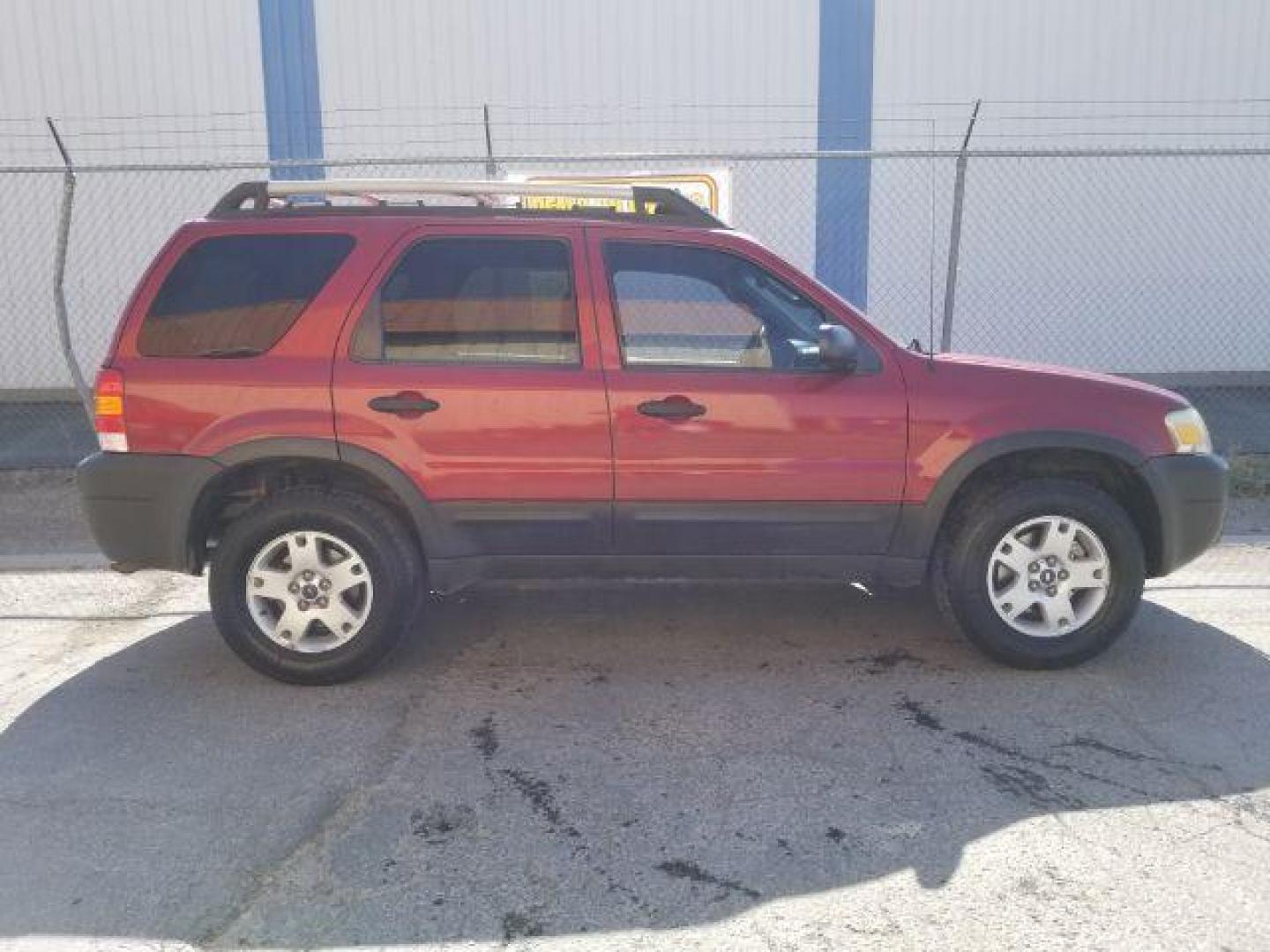 2005 Red Fire Metallic Ford Escape XLT 4WD (1FMYU93125K) with an 3.0L V6 DOHC 24V engine, 4-Speed Automatic transmission, located at 4801 10th Ave S,, Great Falls, MT, 59405, 47.494347, -111.229942 - Photo#5