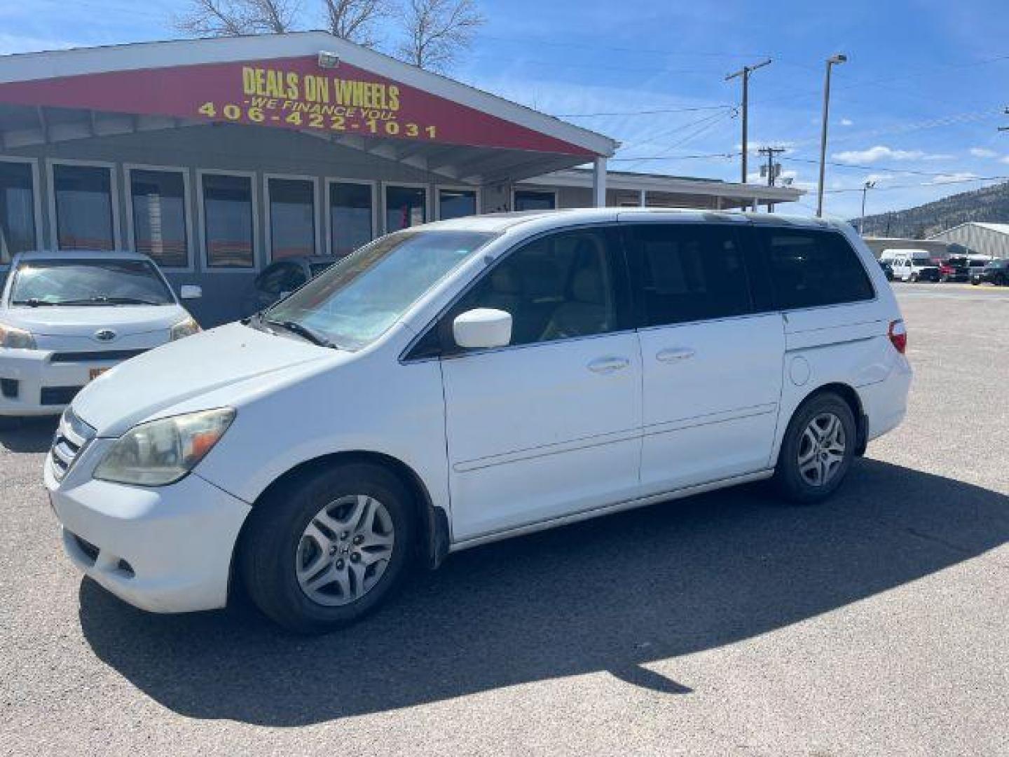 2005 Honda Odyssey EX w/ Leather DVD (5FNRL38745B) with an 3.5L V6 SOHC 24V engine, 5-Speed Automatic transmission, located at 1821 N Montana Ave., Helena, MT, 59601, 46.603447, -112.022781 - Photo#0