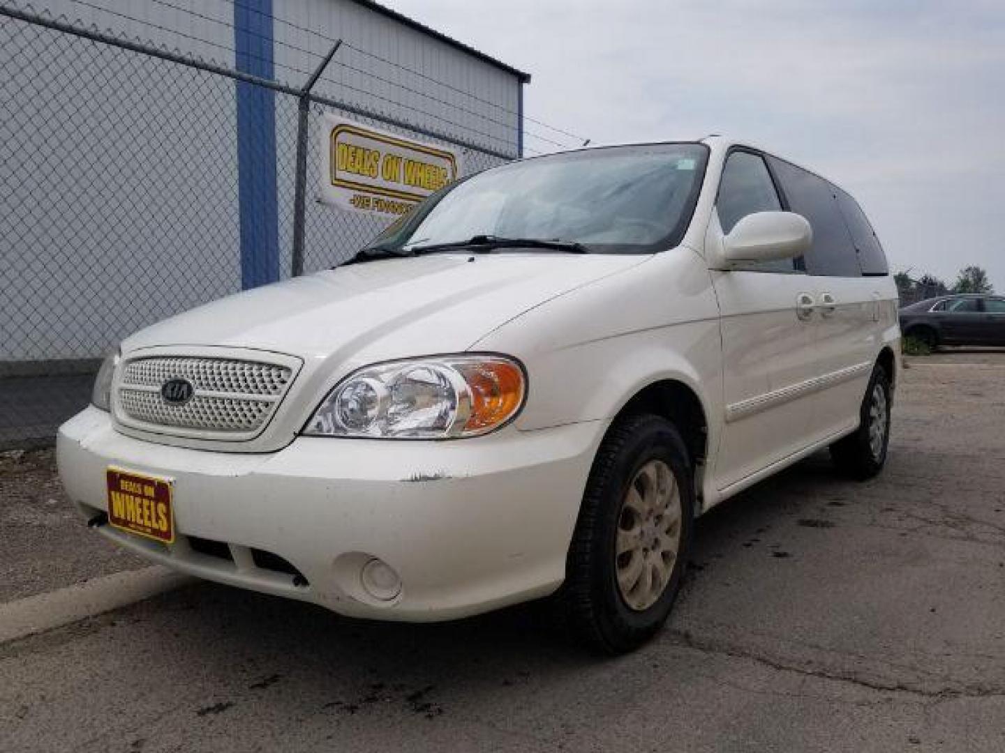 2005 Clear White /Beige Cloth Interior Kia Sedona LX (KNDUP132856) with an 3.5L V6 DOHC 16V engine, 5-Speed Automatic transmission, located at 4801 10th Ave S,, Great Falls, MT, 59405, 47.494347, -111.229942 - Photo#0