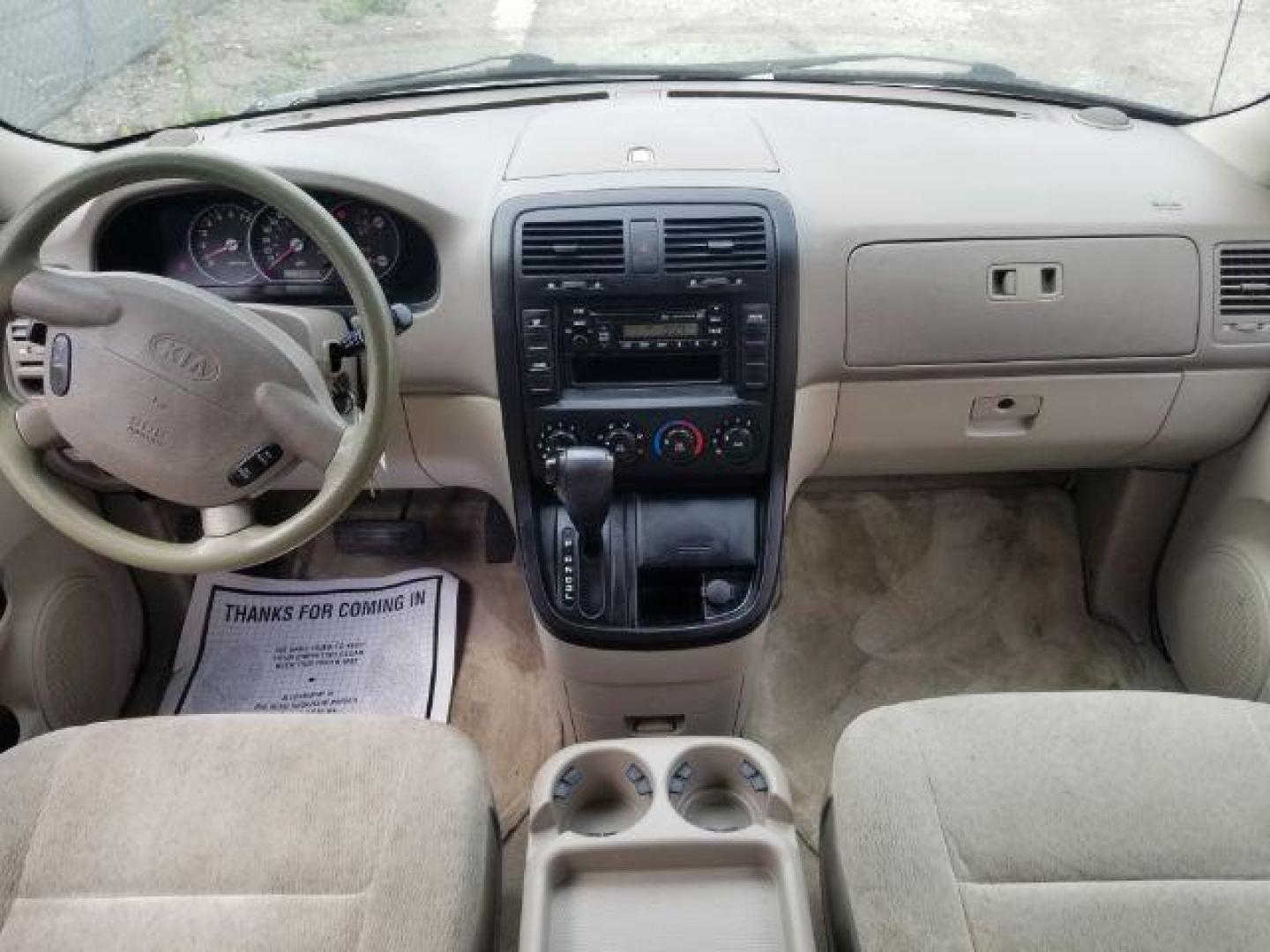 2005 Clear White /Beige Cloth Interior Kia Sedona LX (KNDUP132856) with an 3.5L V6 DOHC 16V engine, 5-Speed Automatic transmission, located at 4801 10th Ave S,, Great Falls, MT, 59405, 47.494347, -111.229942 - Photo#11