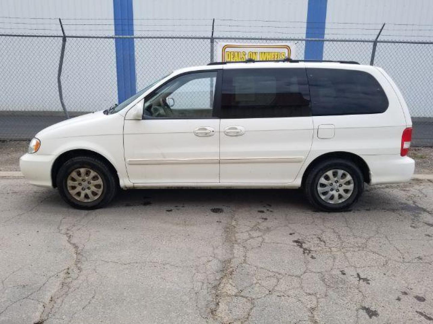 2005 Clear White /Beige Cloth Interior Kia Sedona LX (KNDUP132856) with an 3.5L V6 DOHC 16V engine, 5-Speed Automatic transmission, located at 4801 10th Ave S,, Great Falls, MT, 59405, 47.494347, -111.229942 - Photo#2