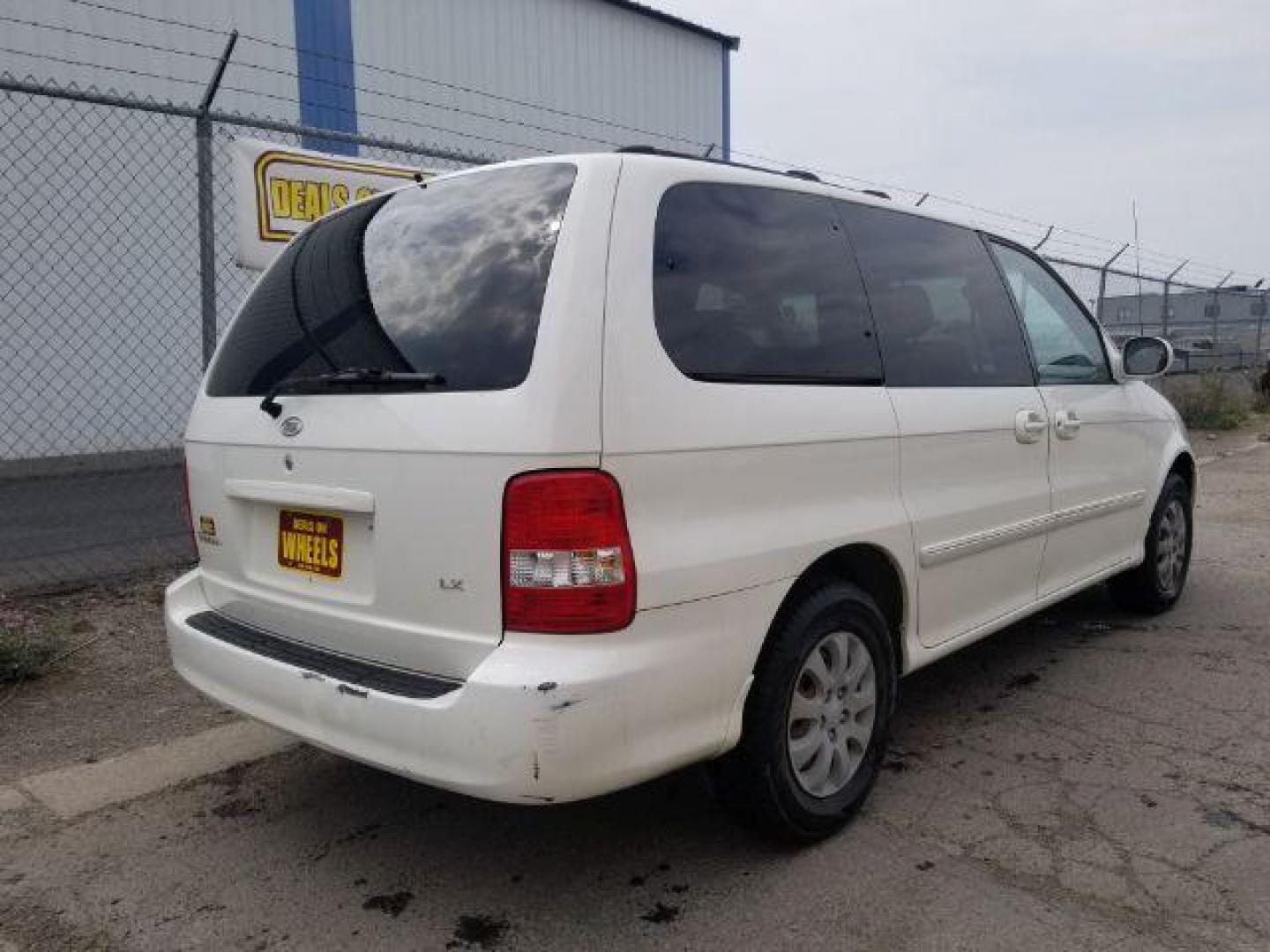 2005 Clear White /Beige Cloth Interior Kia Sedona LX (KNDUP132856) with an 3.5L V6 DOHC 16V engine, 5-Speed Automatic transmission, located at 4801 10th Ave S,, Great Falls, MT, 59405, 47.494347, -111.229942 - Photo#4