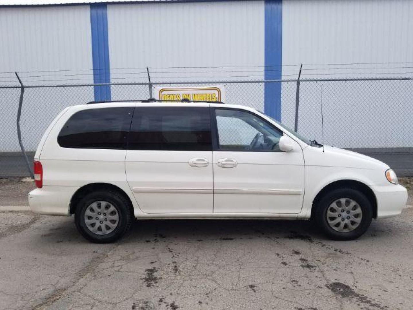 2005 Clear White /Beige Cloth Interior Kia Sedona LX (KNDUP132856) with an 3.5L V6 DOHC 16V engine, 5-Speed Automatic transmission, located at 4801 10th Ave S,, Great Falls, MT, 59405, 47.494347, -111.229942 - Photo#5