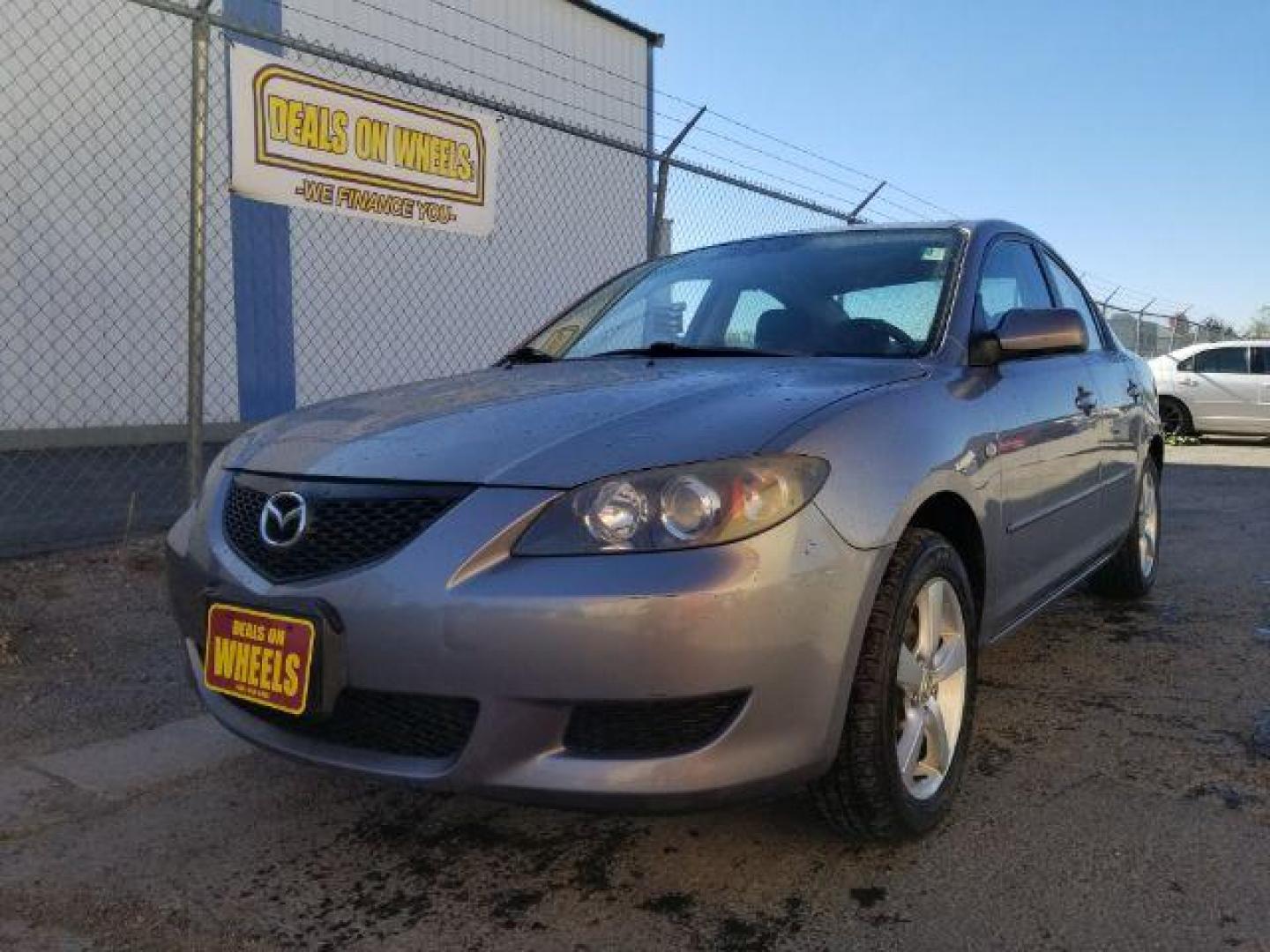 2006 Mazda MAZDA3 i 4-door (JM1BK12FX61) with an 2.0L L4 DOHC 16V engine, located at 601 E. Idaho St., Kalispell, MT, 59901, 48.203983, -114.308662 - Photo#0