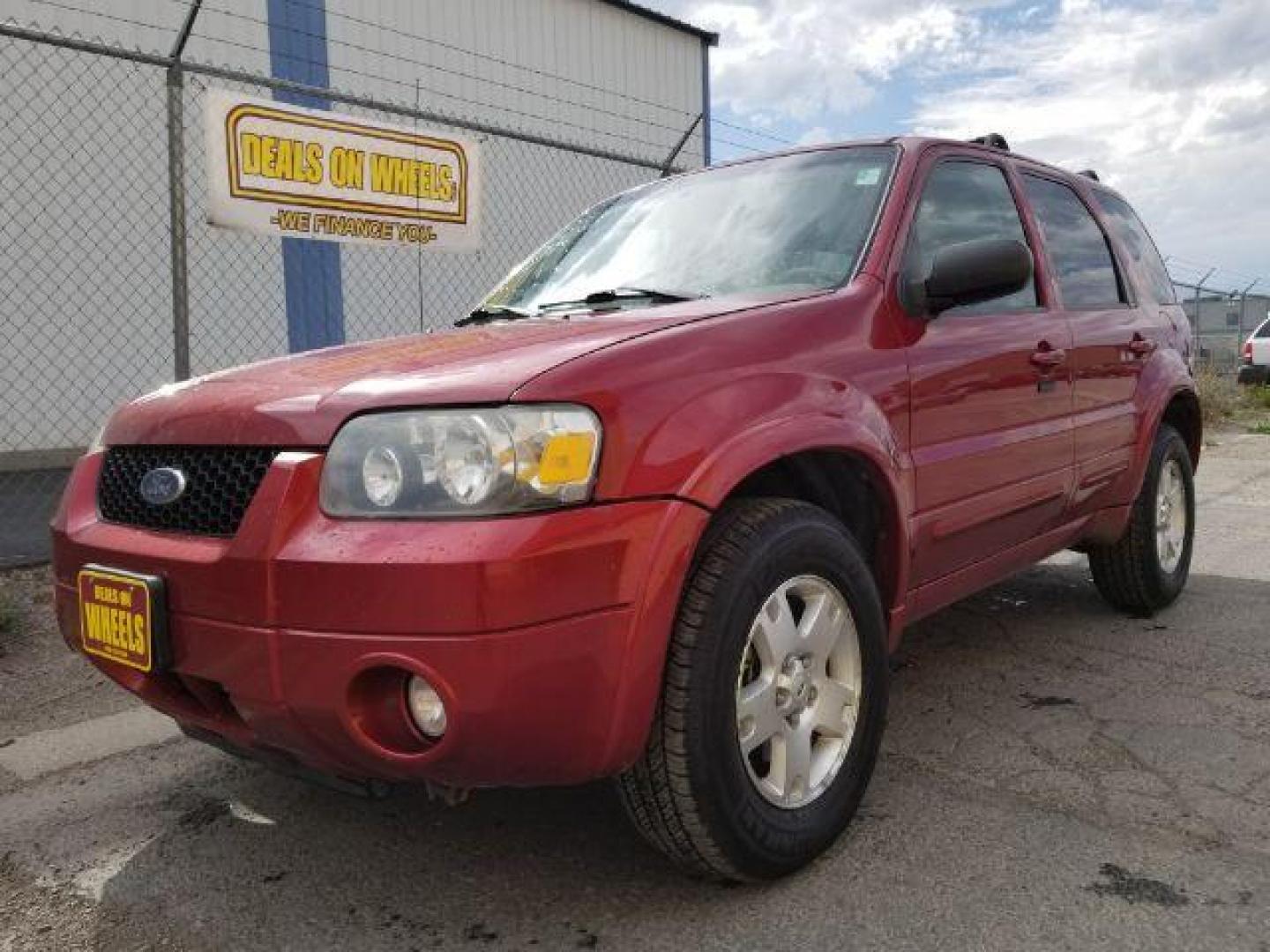 2007 Red Fire Metallic Ford Escape Limited 4WD (1FMYU94127K) with an 3.0L V6 DOHC 24V engine, 4-Speed Automatic transmission, located at 4801 10th Ave S,, Great Falls, MT, 59405, 47.494347, -111.229942 - Photo#0