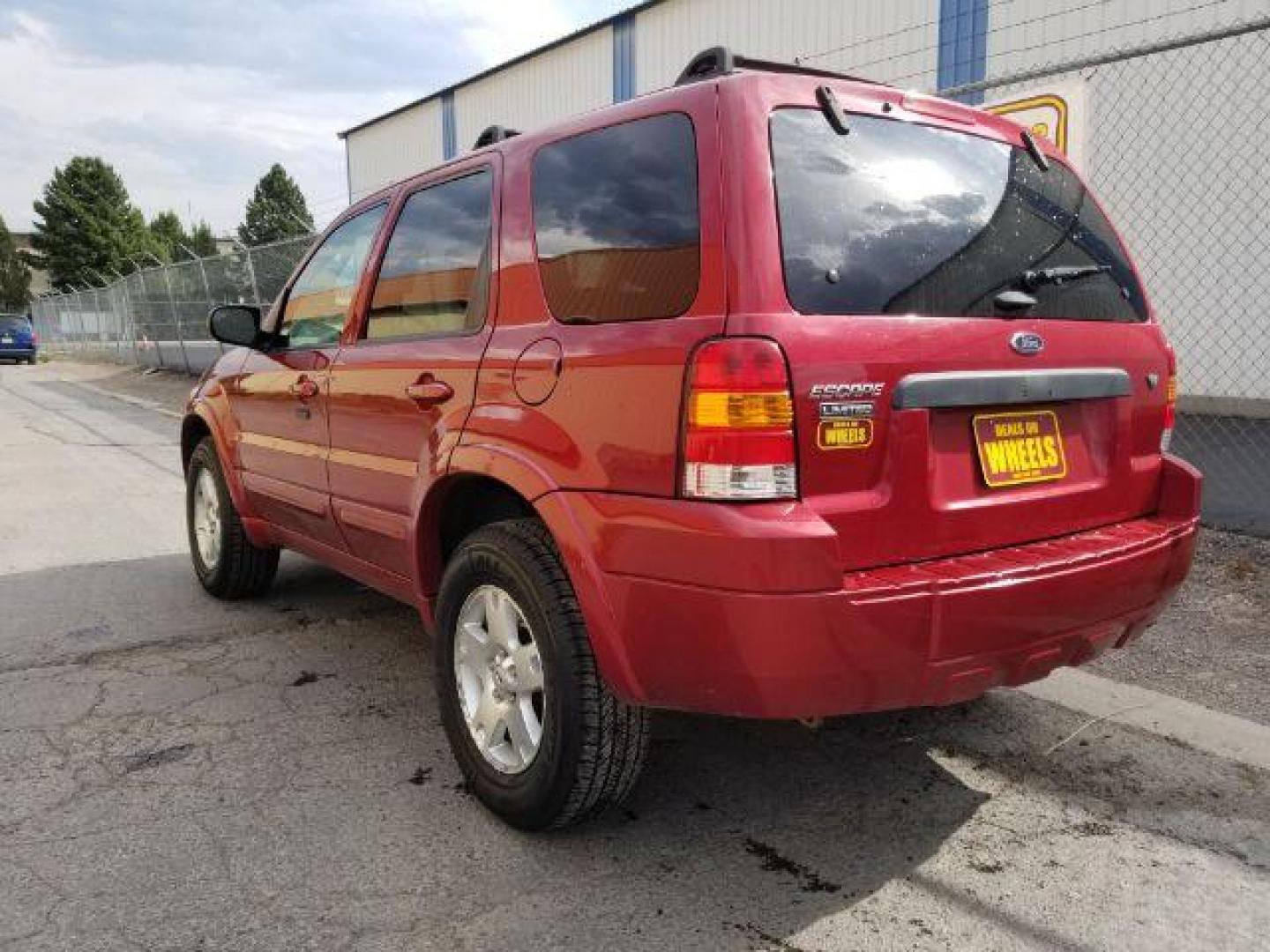 2007 Red Fire Metallic Ford Escape Limited 4WD (1FMYU94127K) with an 3.0L V6 DOHC 24V engine, 4-Speed Automatic transmission, located at 4801 10th Ave S,, Great Falls, MT, 59405, 47.494347, -111.229942 - Photo#2