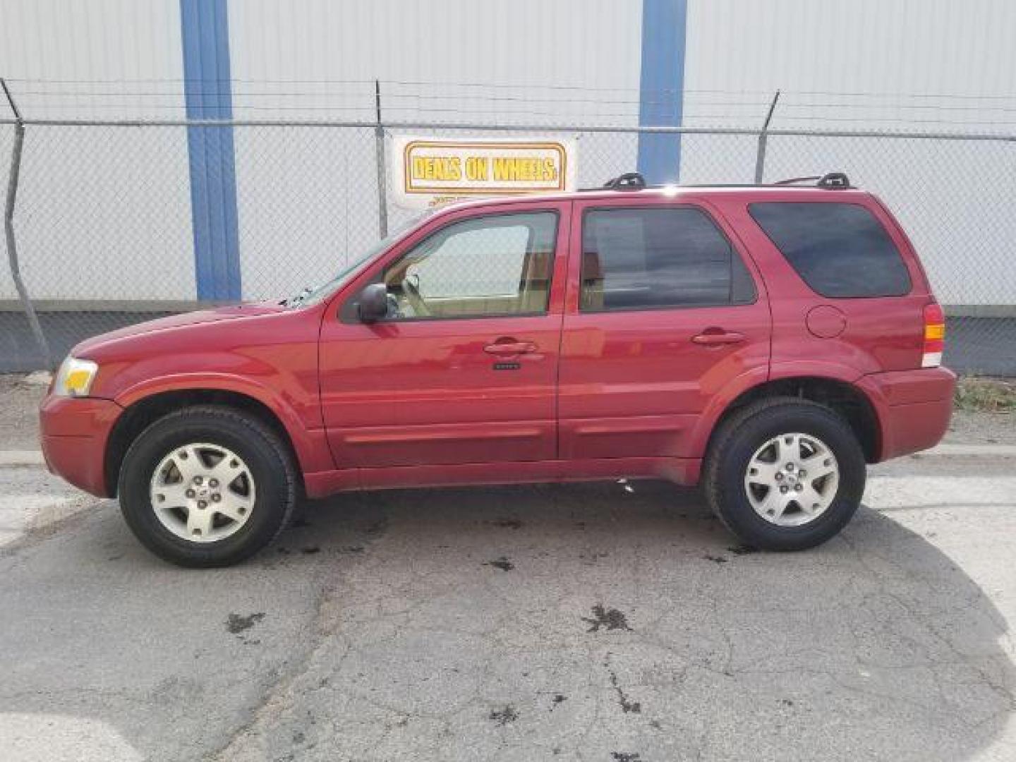 2007 Red Fire Metallic Ford Escape Limited 4WD (1FMYU94127K) with an 3.0L V6 DOHC 24V engine, 4-Speed Automatic transmission, located at 4801 10th Ave S,, Great Falls, MT, 59405, 47.494347, -111.229942 - Photo#3