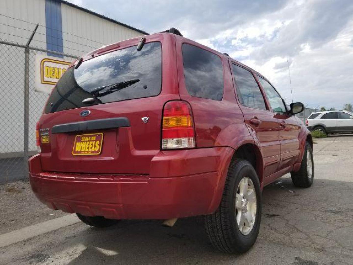 2007 Red Fire Metallic Ford Escape Limited 4WD (1FMYU94127K) with an 3.0L V6 DOHC 24V engine, 4-Speed Automatic transmission, located at 4801 10th Ave S,, Great Falls, MT, 59405, 47.494347, -111.229942 - Photo#4