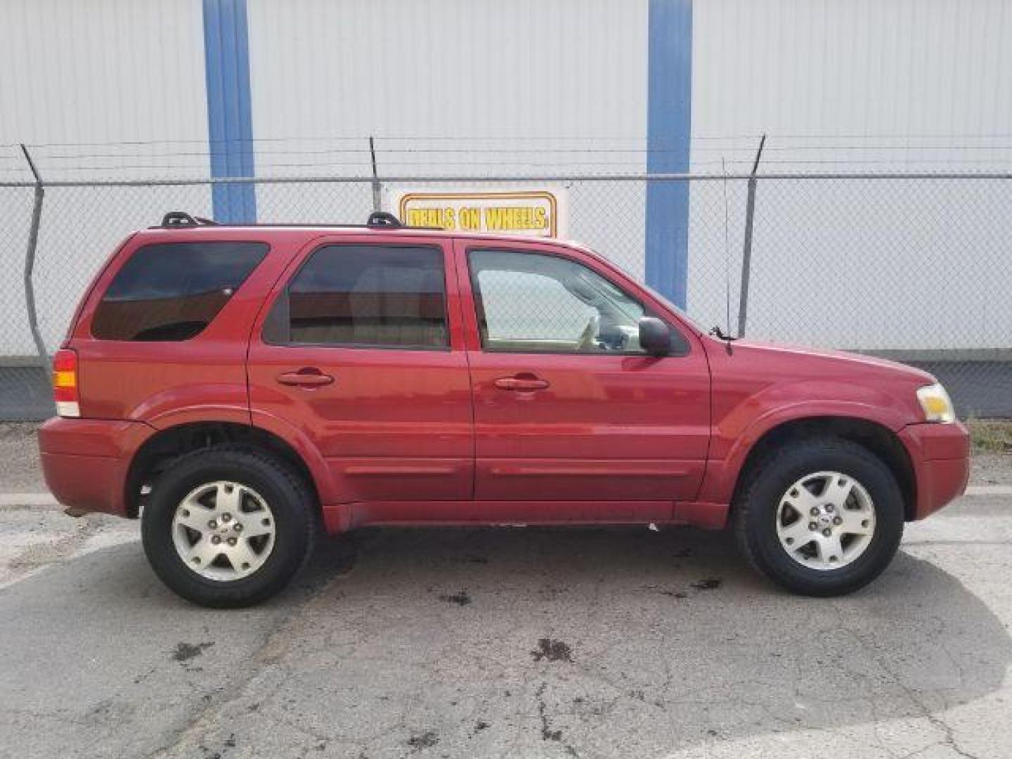 2007 Red Fire Metallic Ford Escape Limited 4WD (1FMYU94127K) with an 3.0L V6 DOHC 24V engine, 4-Speed Automatic transmission, located at 4801 10th Ave S,, Great Falls, MT, 59405, 47.494347, -111.229942 - Photo#5