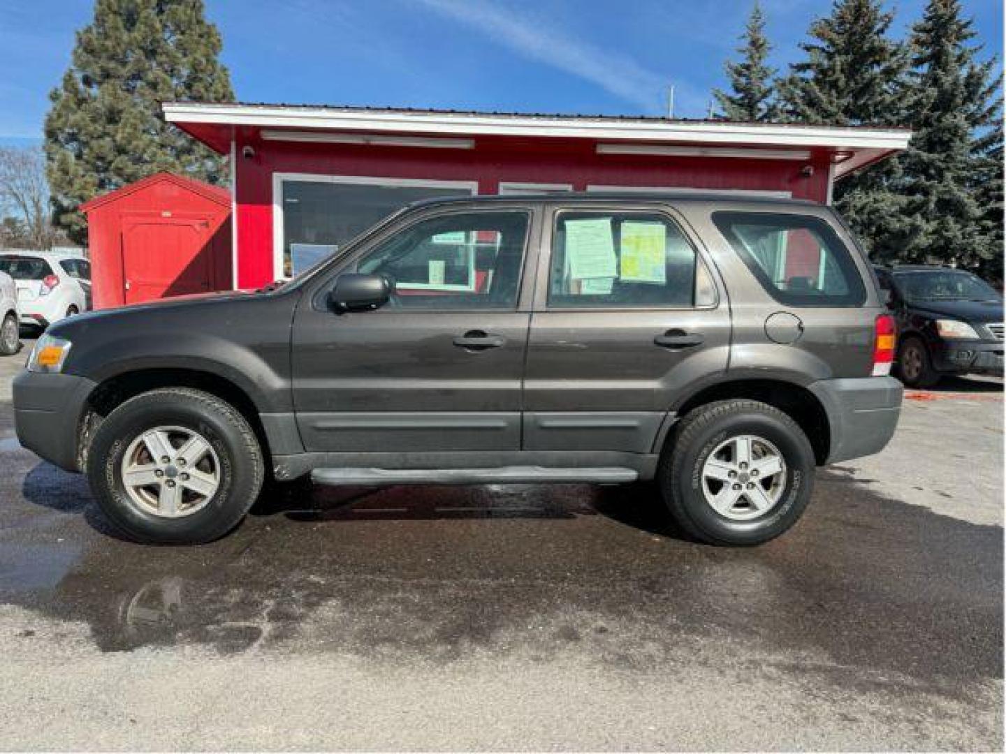 2007 Tungsten Grey Metallic Ford Escape XLS 4WD (1FMCU92Z87K) with an 2.3L L4 DOHC 16V engine, 4-Speed Automatic transmission, located at 601 E. Idaho St., Kalispell, MT, 59901, 48.203983, -114.308662 - Photo#1