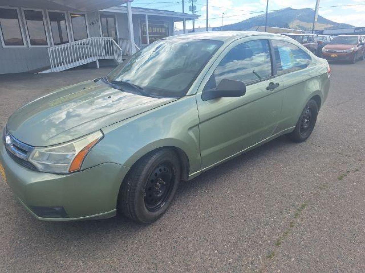 2008 GREEN FORD FOCUS green (1FAHP32N58W) with an 2.0L 16V engine, Manual transmission, located at 1821 N Montana Ave., Helena, MT, 59601, 46.603447, -112.022781 - Photo#0