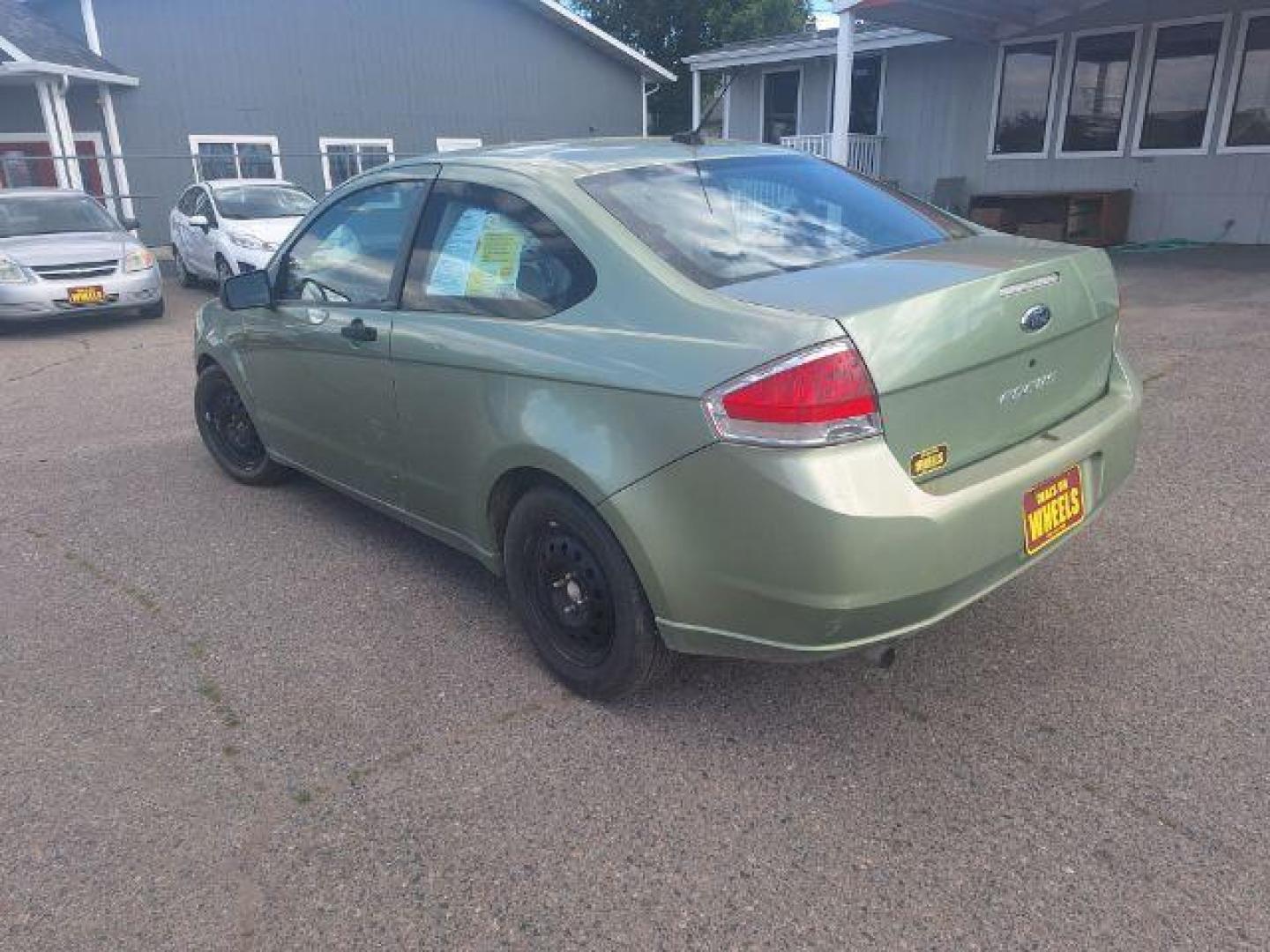 2008 GREEN FORD FOCUS green (1FAHP32N58W) with an 2.0L 16V engine, Manual transmission, located at 1821 N Montana Ave., Helena, MT, 59601, 46.603447, -112.022781 - Photo#1