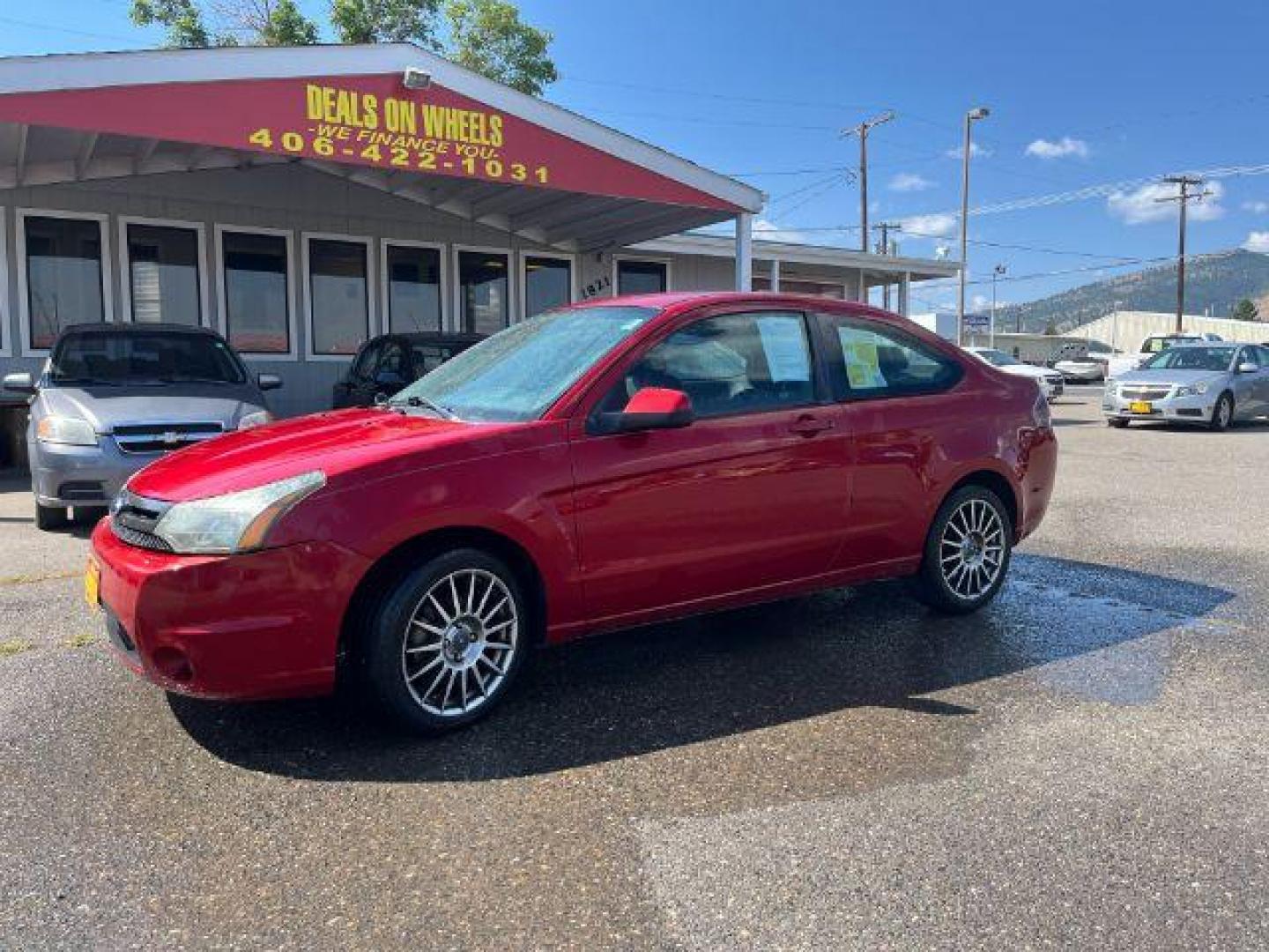 2009 Ford Focus SES Coupe (1FAHP33NX9W) with an 2.0L L4 DOHC 16V engine, located at 1821 N Montana Ave., Helena, MT, 59601, 46.603447, -112.022781 - Photo#0