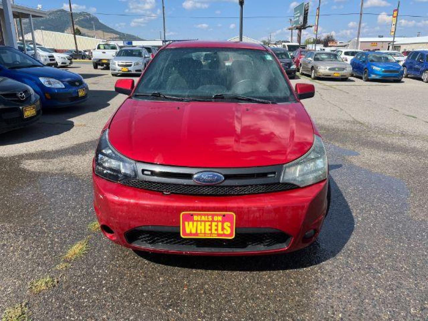 2009 Ford Focus SES Coupe (1FAHP33NX9W) with an 2.0L L4 DOHC 16V engine, located at 1821 N Montana Ave., Helena, MT, 59601, 46.603447, -112.022781 - Photo#1