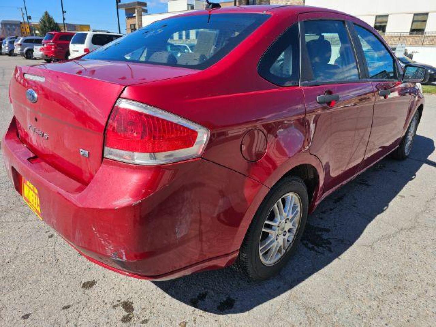 2009 Sangria Red Metallic /Medium Stone Cloth I Ford Focus SE Sedan (1FAHP35N59W) with an 2.0L L4 DOHC 16V engine, 4-Speed Automatic transmission, located at 1800 West Broadway, Missoula, 59808, (406) 543-1986, 46.881348, -114.023628 - Photo#3