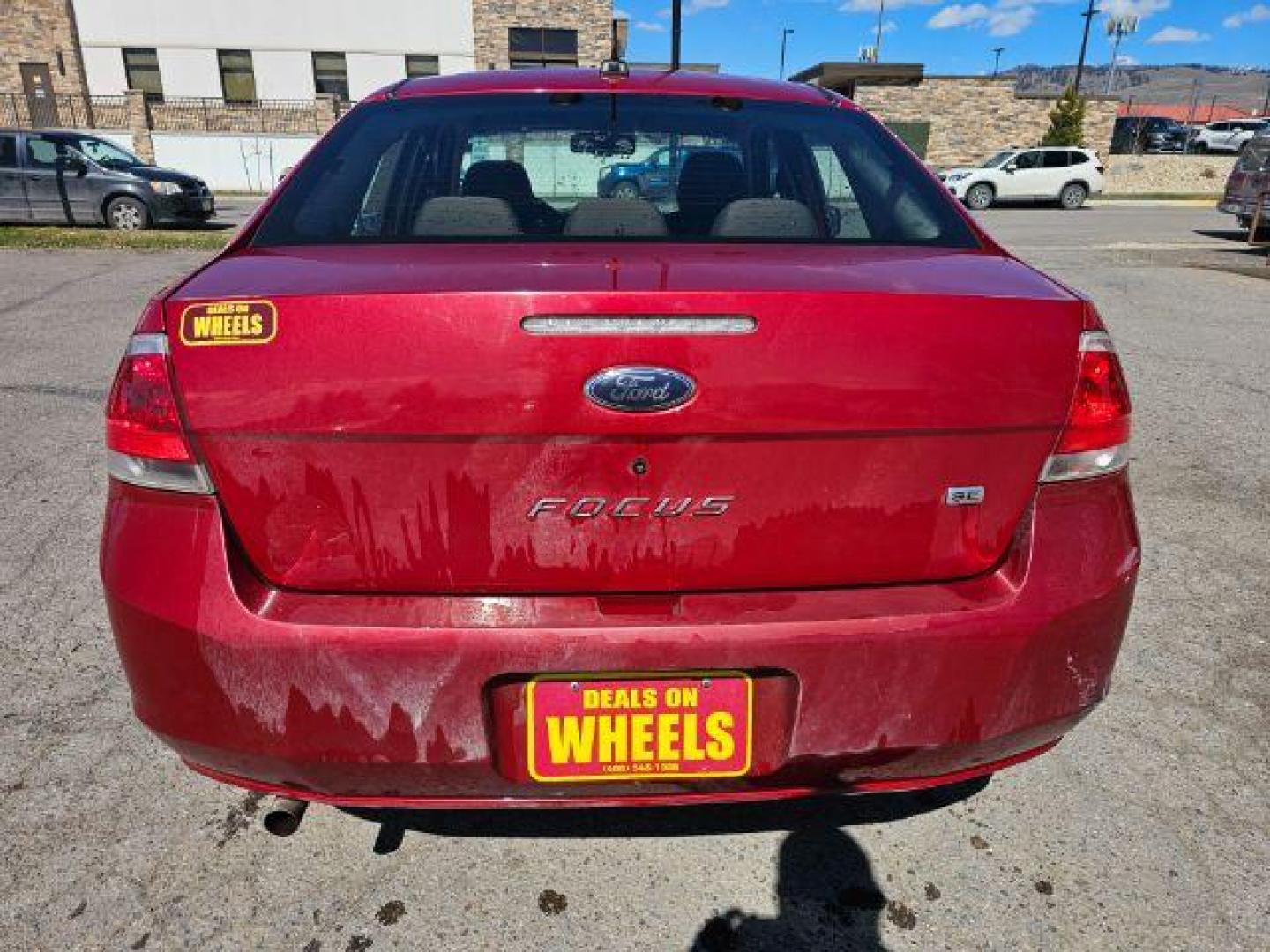 2009 Sangria Red Metallic /Medium Stone Cloth I Ford Focus SE Sedan (1FAHP35N59W) with an 2.0L L4 DOHC 16V engine, 4-Speed Automatic transmission, located at 1800 West Broadway, Missoula, 59808, (406) 543-1986, 46.881348, -114.023628 - Photo#4