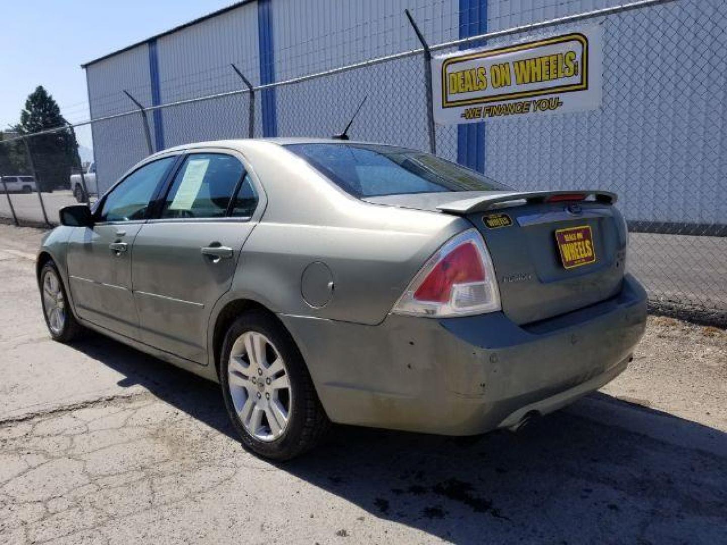 2009 Ford Fusion V6 SEL AWD (3FAHP02119R) with an 3.0L V6 DOHC 24V engine, located at 601 E. Idaho St., Kalispell, MT, 59901, 48.203983, -114.308662 - Photo#3