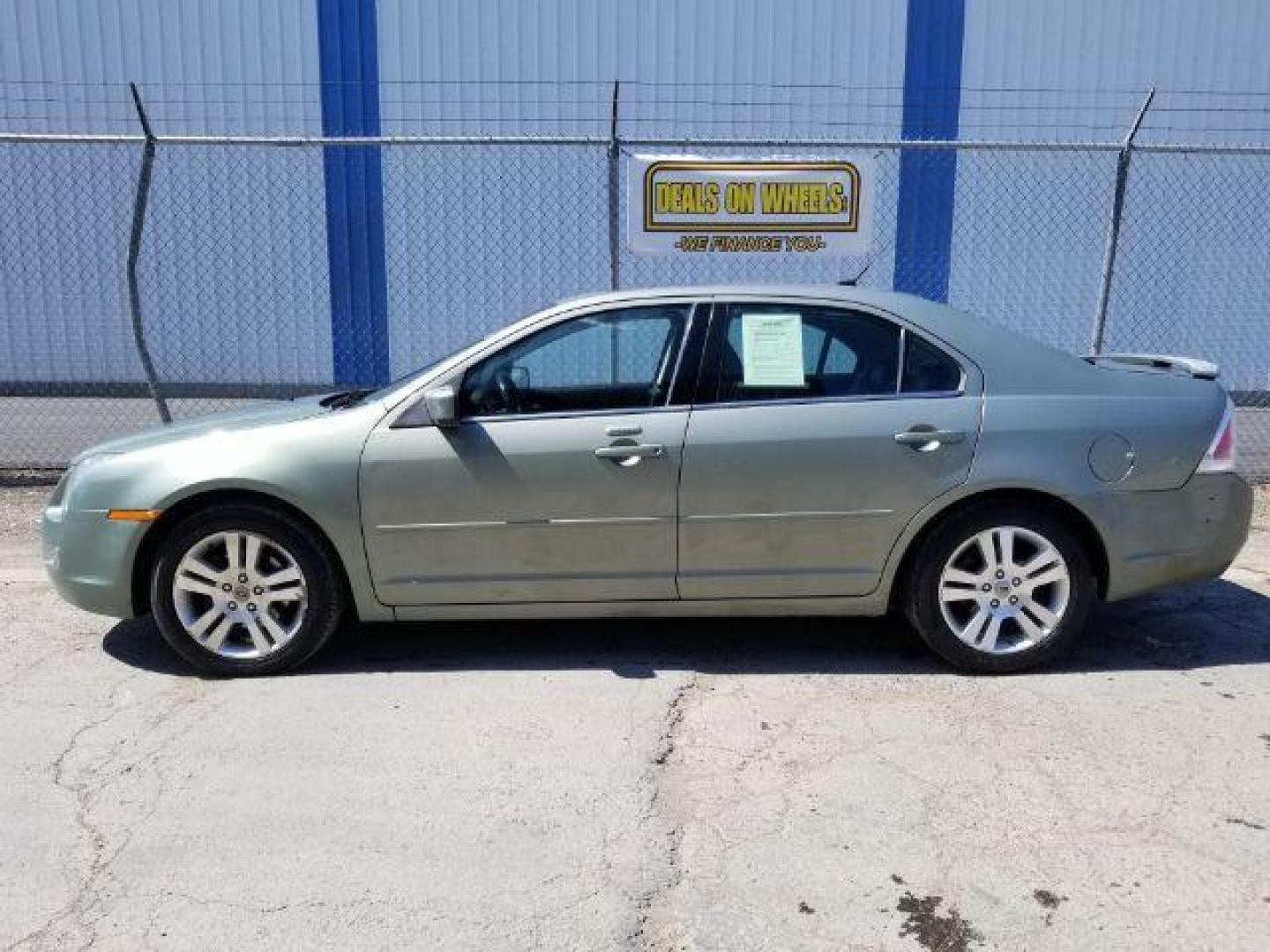 2009 Ford Fusion V6 SEL AWD (3FAHP02119R) with an 3.0L V6 DOHC 24V engine, located at 601 E. Idaho St., Kalispell, MT, 59901, 48.203983, -114.308662 - Photo#2