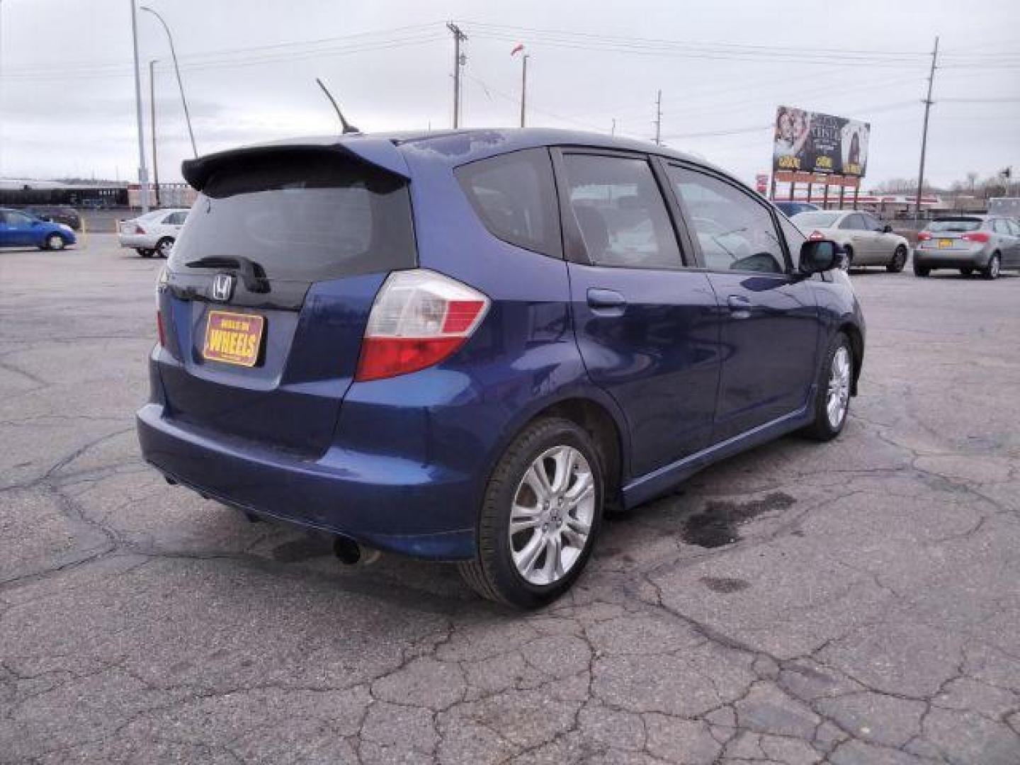 2009 Honda Fit Sport 5-Speed MT (JHMGE87409S) with an 1.5L L4 SOHC 16V engine, 5-Speed Manual transmission, located at 4047 Montana Ave., Billings, MT, 59101, 45.770847, -108.529800 - Photo#2