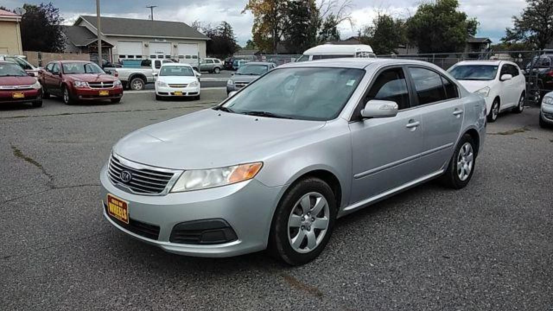 2009 Kia Optima LX (KNAGE228395) with an 2.4L L4 DOHC 16V engine, 4-Speed Automatic transmission, located at 1800 West Broadway, Missoula, 59808, (406) 543-1986, 46.881348, -114.023628 - Looking for a reliable and affordable pre-owned vehicle in Helena, MT? Look no further than this 2009 Kia Optima LX available at DOW - Helena. With a price tag of $13,995, this sedan offers great value for your money. The 2009 Kia Optima LX is powered by a 2.4L L4 DOHC 16V engine, paired with a 4- - Photo#0