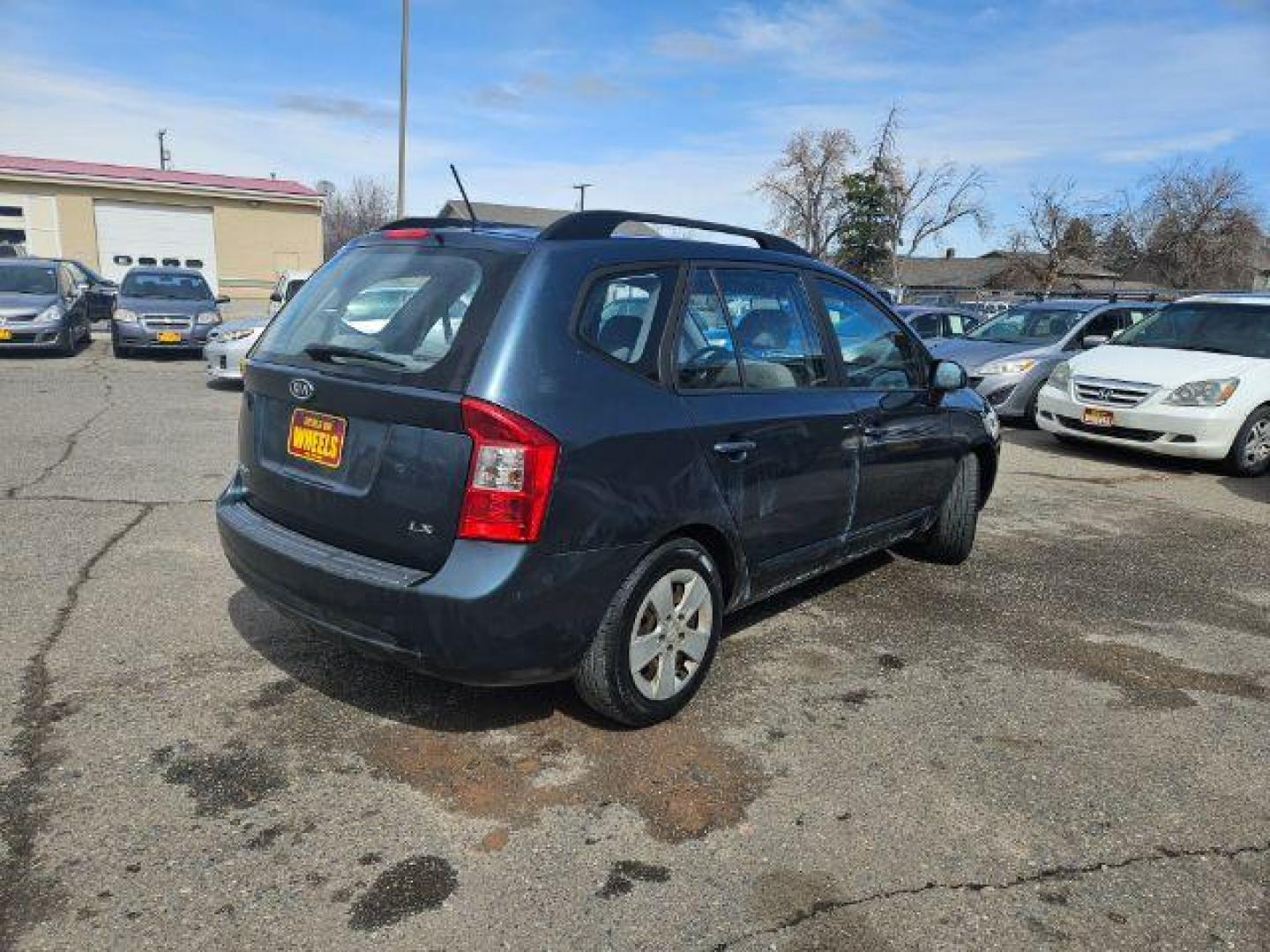 2009 Kia Rondo LX (KNAFG529097) with an 2.4L L4 DOHC 16V engine, 4-Speed Automatic transmission, located at 1821 N Montana Ave., Helena, MT, 59601, 46.603447, -112.022781 - Photo#3