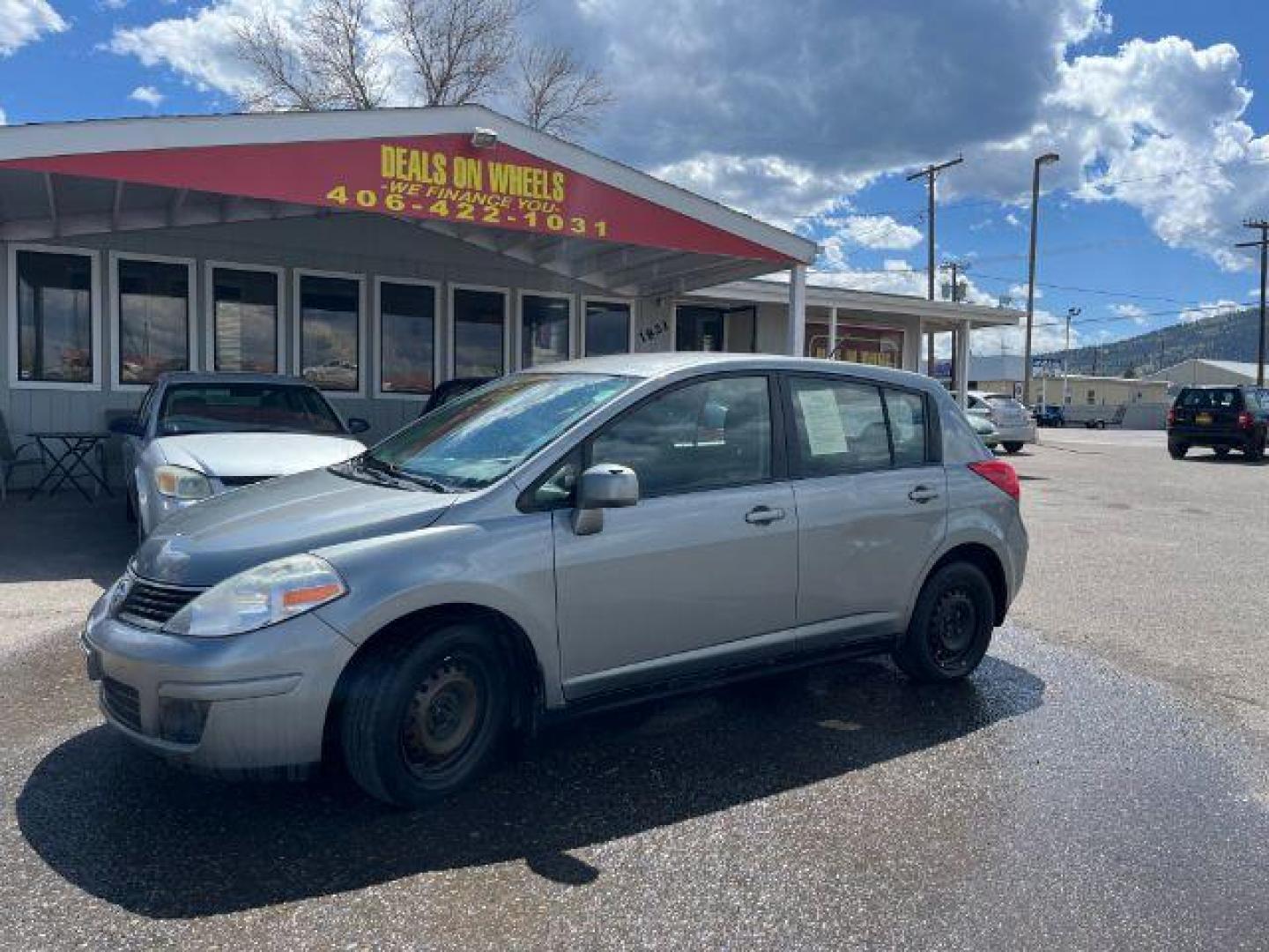 2009 Nissan Versa 1.8 S Hatchback (3N1BC13EX9L) with an 1.8L L4 DOHC 16V engine, located at 1821 N Montana Ave., Helena, MT, 59601, 46.603447, -112.022781 - Photo#0