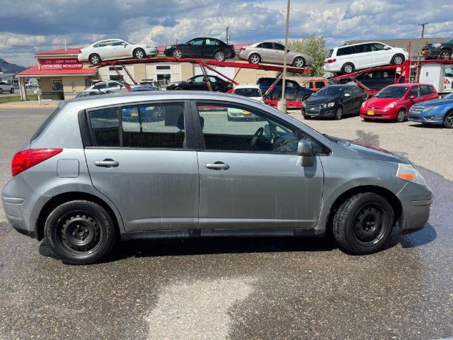 2009 Nissan Versa 1.8 S Hatchback (3N1BC13EX9L) with an 1.8L L4 DOHC 16V engine, located at 1821 N Montana Ave., Helena, MT, 59601, 46.603447, -112.022781 - Photo#2