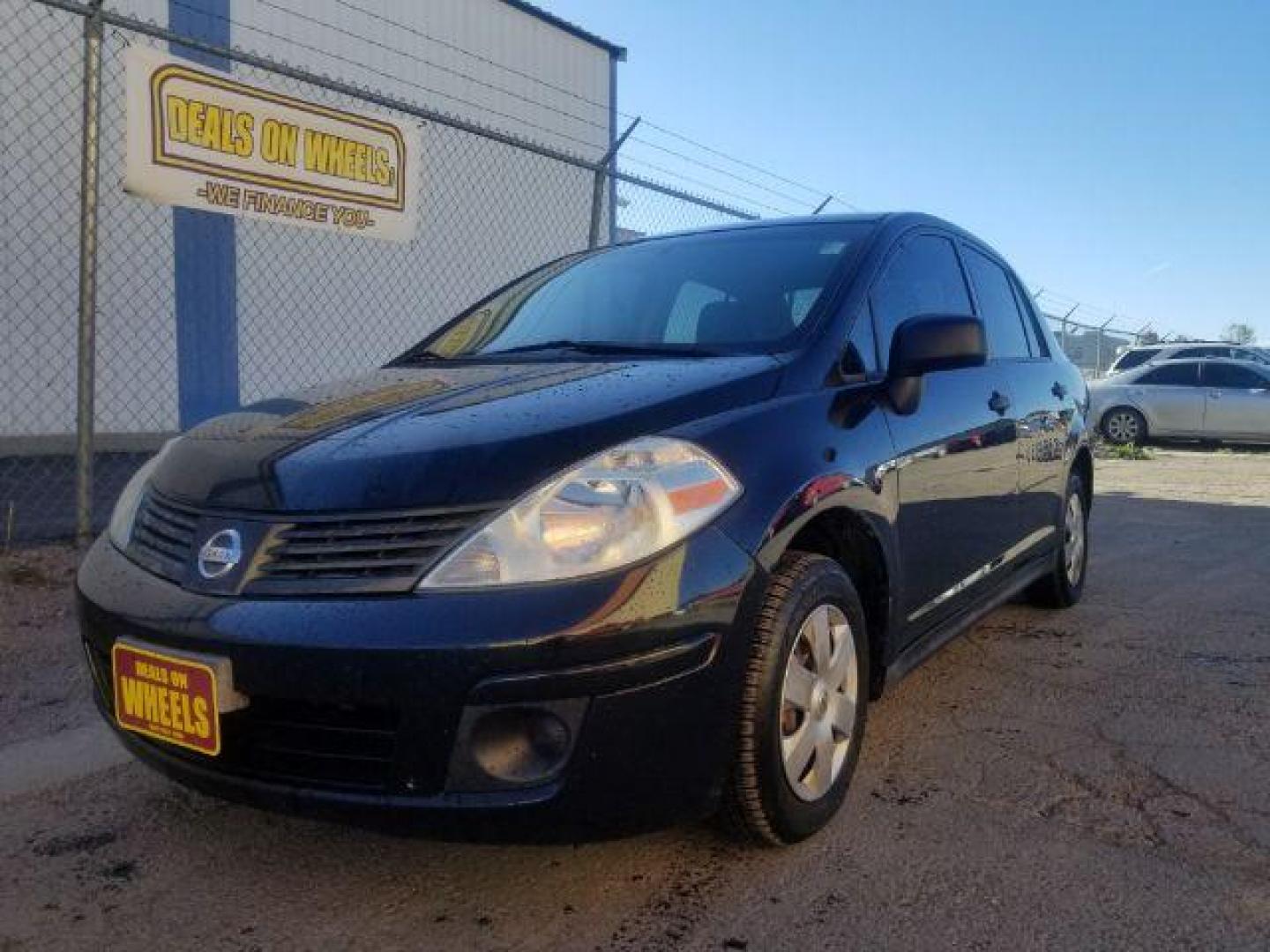 2009 Nissan Versa 1.6 Base Sedan (3N1CC11E79L) with an 1.6L L4 DOHC 16V engine, 5-Speed Manual transmission, located at 601 E. Idaho St., Kalispell, MT, 59901, 48.203983, -114.308662 - Photo#0