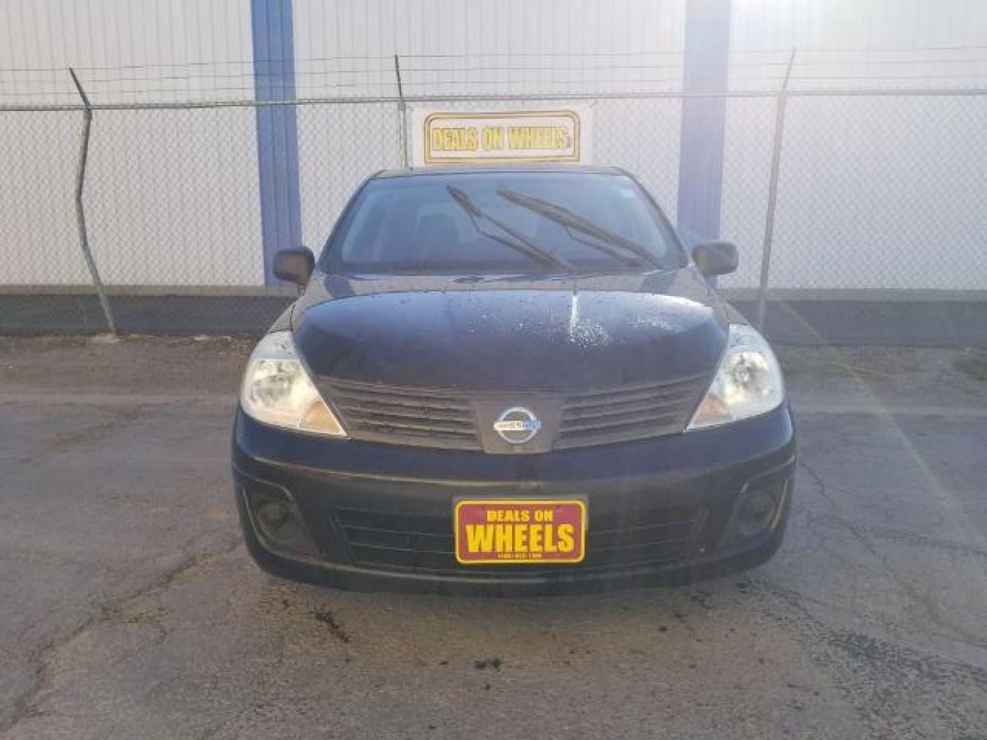 2009 Nissan Versa 1.6 Base Sedan (3N1CC11E79L) with an 1.6L L4 DOHC 16V engine, 5-Speed Manual transmission, located at 601 E. Idaho St., Kalispell, MT, 59901, 48.203983, -114.308662 - Photo#1