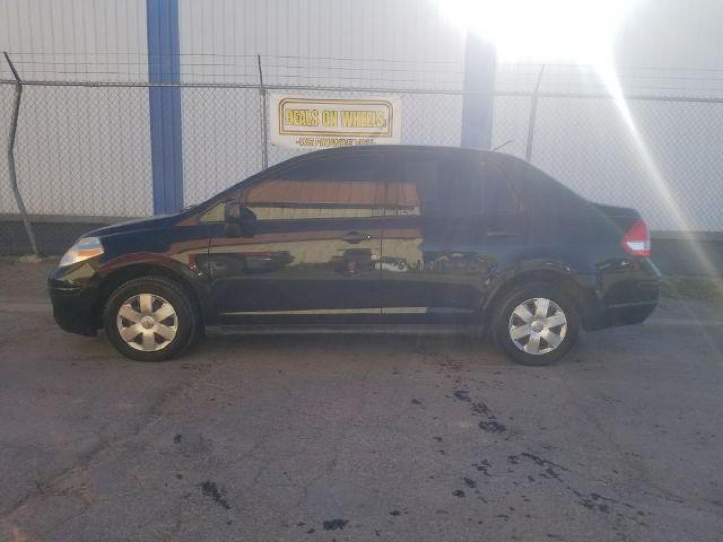 2009 Nissan Versa 1.6 Base Sedan (3N1CC11E79L) with an 1.6L L4 DOHC 16V engine, 5-Speed Manual transmission, located at 601 E. Idaho St., Kalispell, MT, 59901, 48.203983, -114.308662 - Photo#2