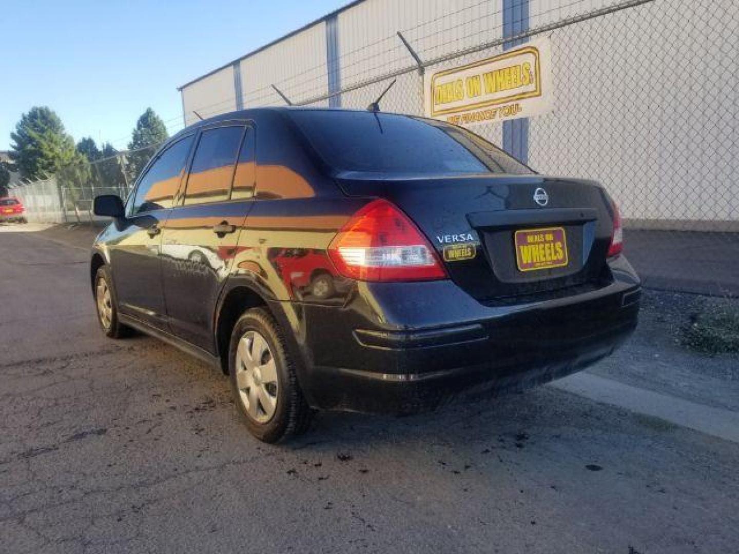 2009 Nissan Versa 1.6 Base Sedan (3N1CC11E79L) with an 1.6L L4 DOHC 16V engine, 5-Speed Manual transmission, located at 601 E. Idaho St., Kalispell, MT, 59901, 48.203983, -114.308662 - Photo#3