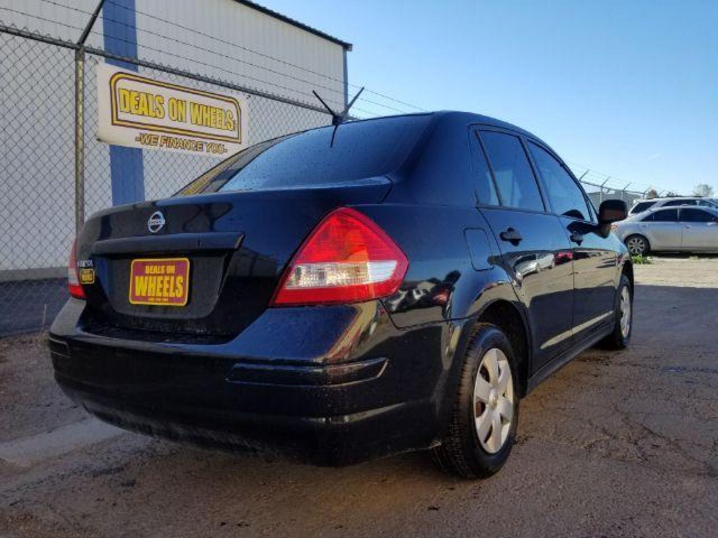 2009 Nissan Versa 1.6 Base Sedan (3N1CC11E79L) with an 1.6L L4 DOHC 16V engine, 5-Speed Manual transmission, located at 601 E. Idaho St., Kalispell, MT, 59901, 48.203983, -114.308662 - Photo#4