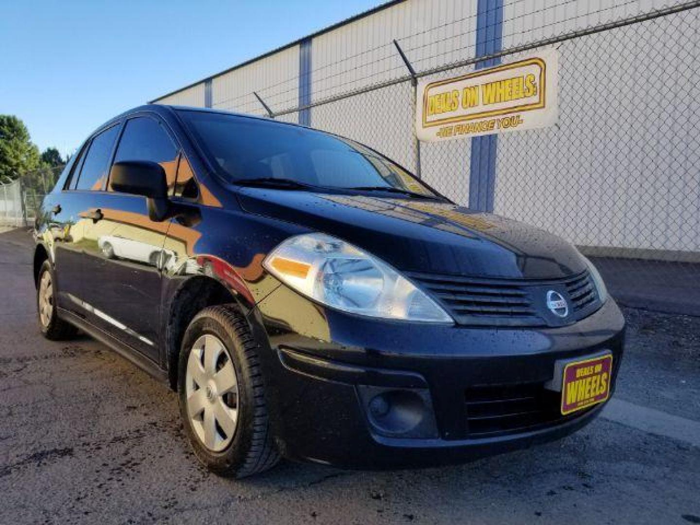 2009 Nissan Versa 1.6 Base Sedan (3N1CC11E79L) with an 1.6L L4 DOHC 16V engine, 5-Speed Manual transmission, located at 601 E. Idaho St., Kalispell, MT, 59901, 48.203983, -114.308662 - Photo#6