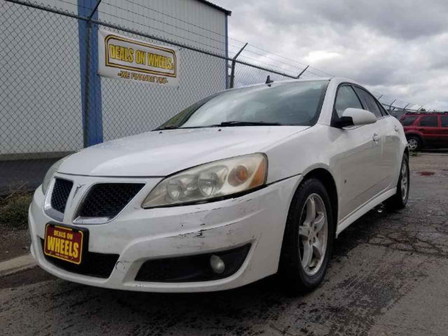 2009 Pontiac G6 Sedan (1G2ZJ57K694) with an 3.5L V6 OHV 12V engine, 4-Speed Automatic transmission, located at 601 E. Idaho St., Kalispell, MT, 59901, 48.203983, -114.308662 - Photo#0